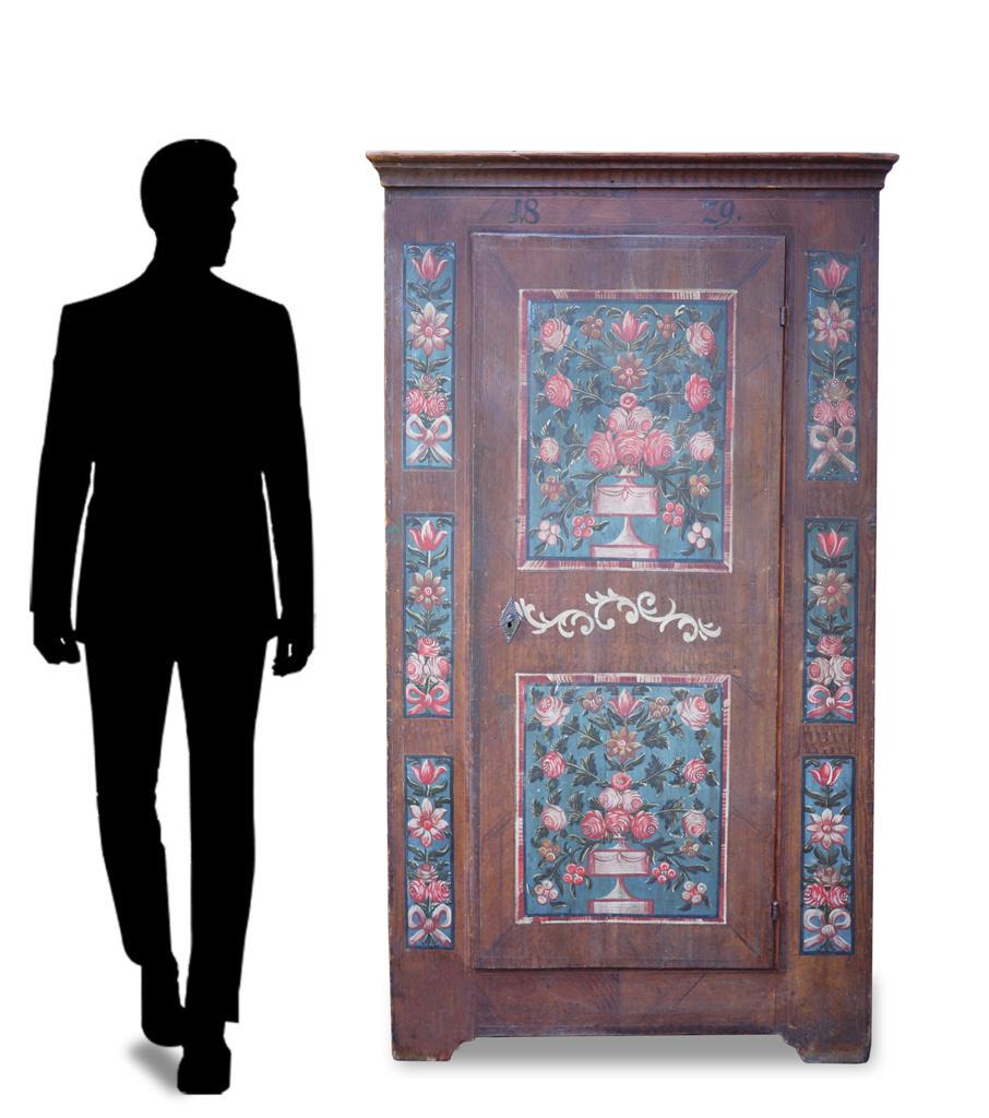 Antique Central Europe painted cabinet dated 1829

Measures: H. 175cm, L. 95cm (100 to the frames), P. 43cm (47 to the frames)

Tyrolean wardrobe dated 1829 with rich floral decorations.
Two large squares with flowered cups characterize the