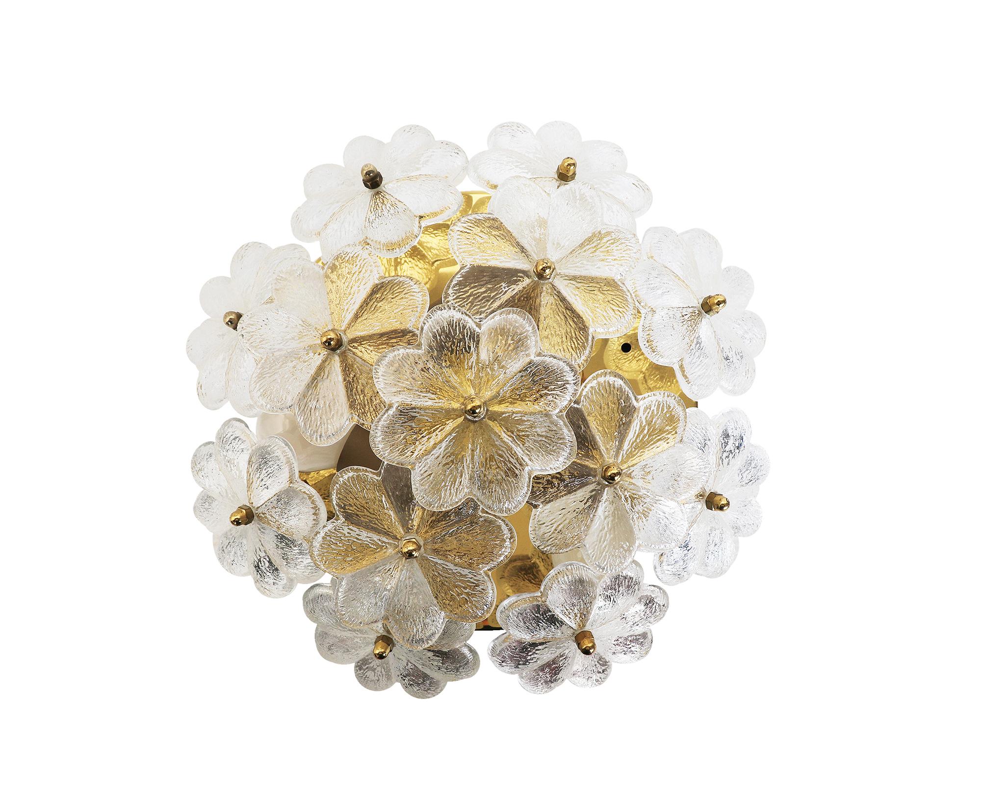 Elegant crystal and brass flush mount with 13 overlapping clear glass flowers manufactured in the 1960s by Palwa (Palme & Walter), Germany.

Design: Ernst Palme.
Measures: diameter appr. 11.8