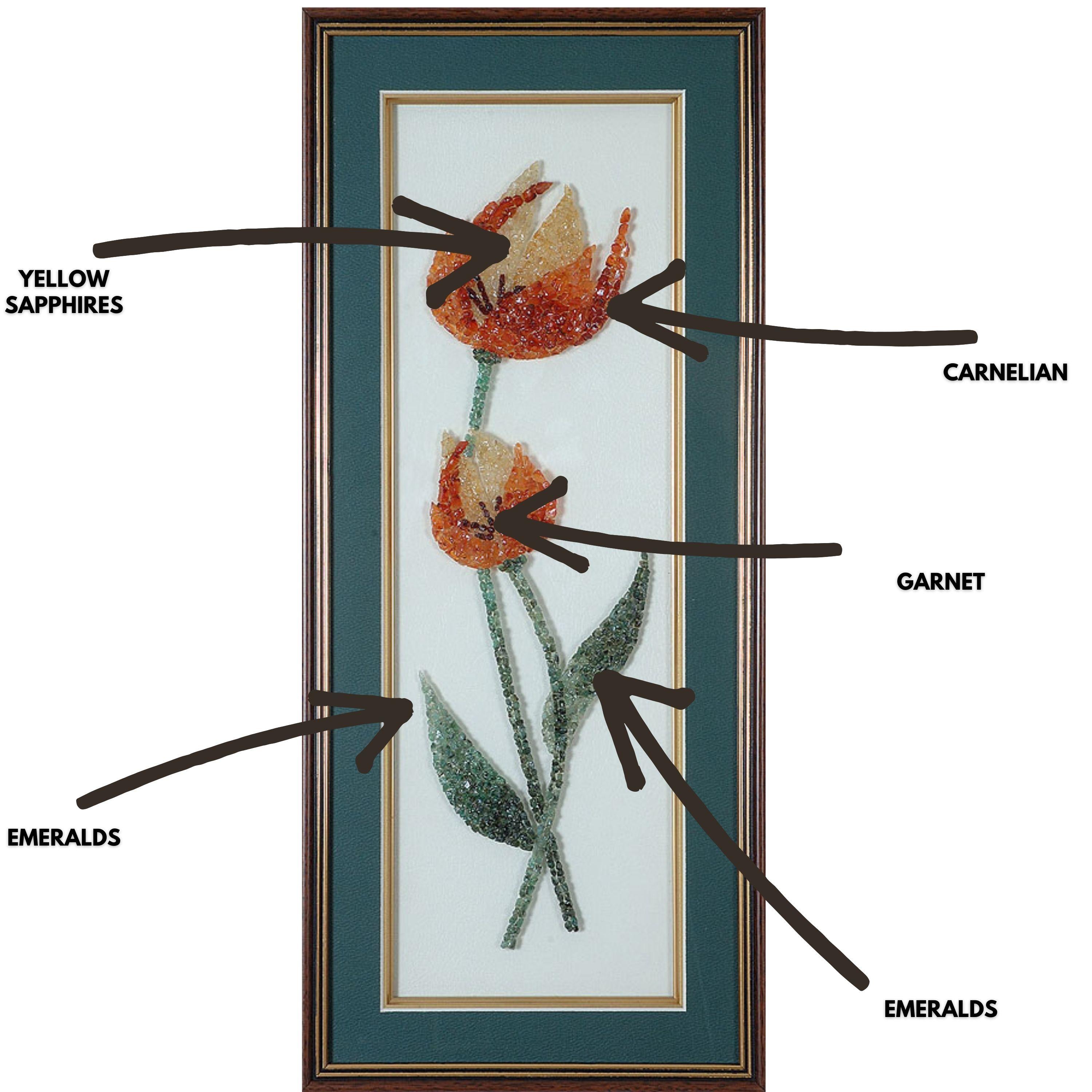 A gorgeous and very colourful Floral Panel made using Carnelians, Garnett, Emeralds and Yellow Sapphire. The gemstones used in this artwork is completely natural, without any treatment. The size of the artwork is 21 inches x 12 inches. The frame is