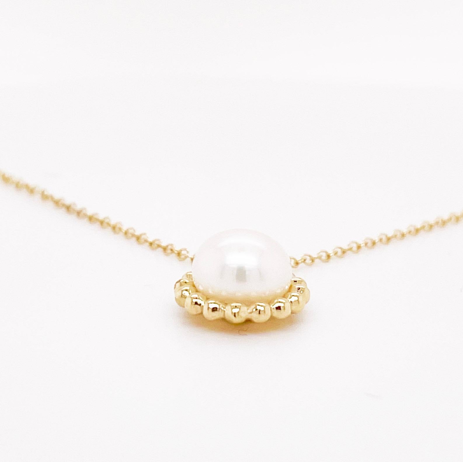 This lovely pearl necklace has a gold beaded frame around it.  It also matches a ring and earring set that we have listed on 1stDibs.  The necklace is stunning with one genuine cultured pearl in the center.  The chain has three setting so that you