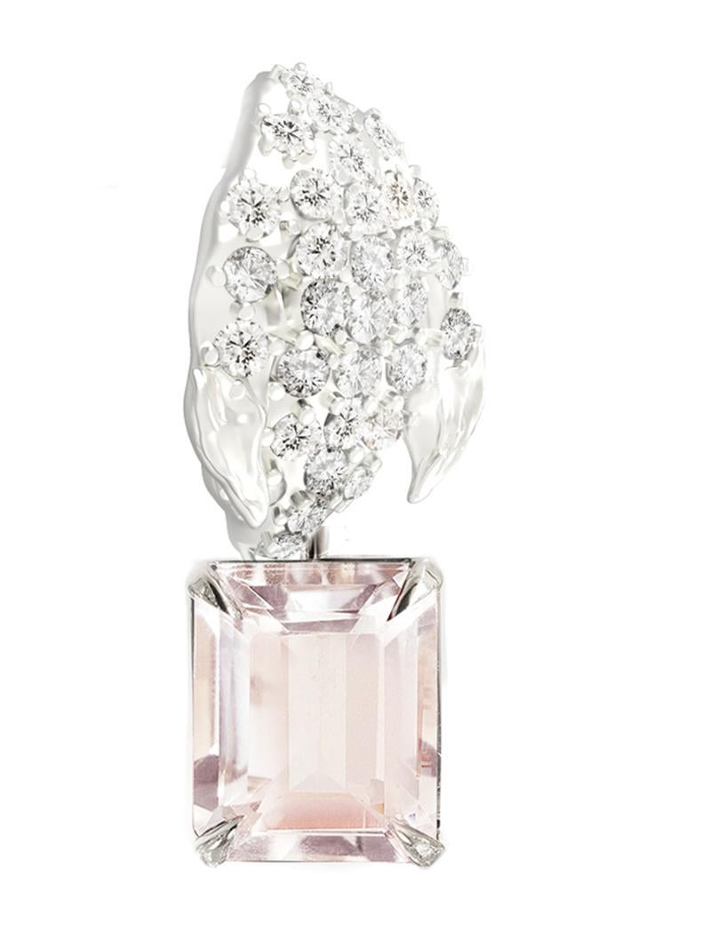 This contemporary Peony Petal floral brooch is in 18 karat white gold with 31 round natural diamonds, VS, F-G, and natural octagon cut morganite. The sculptural design adds the extra highlights to the surface of the gold. The diamonds add the