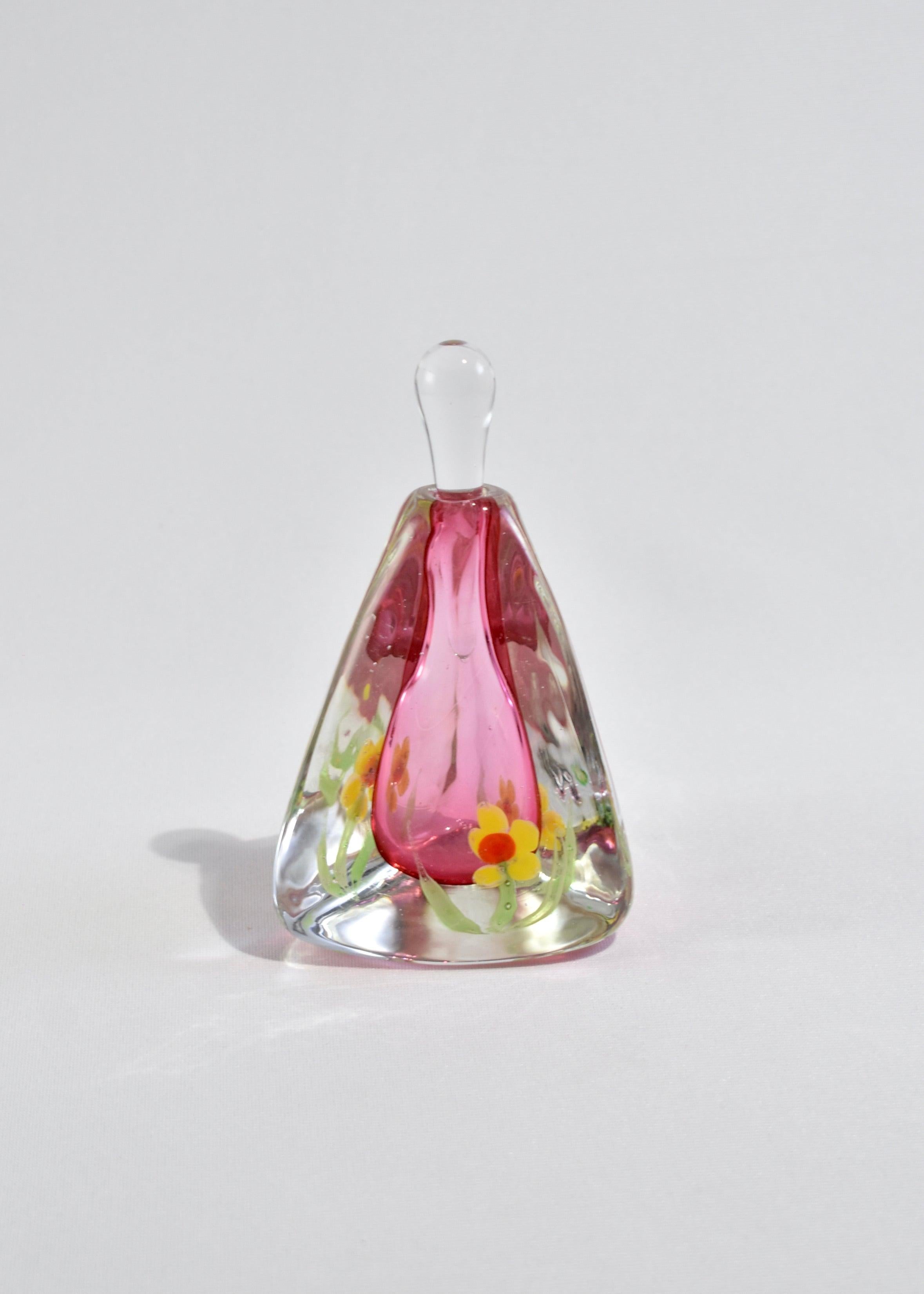 Beautiful pink blown glass perfume bottle with yellow flower detail. Made in Murano, Italy.