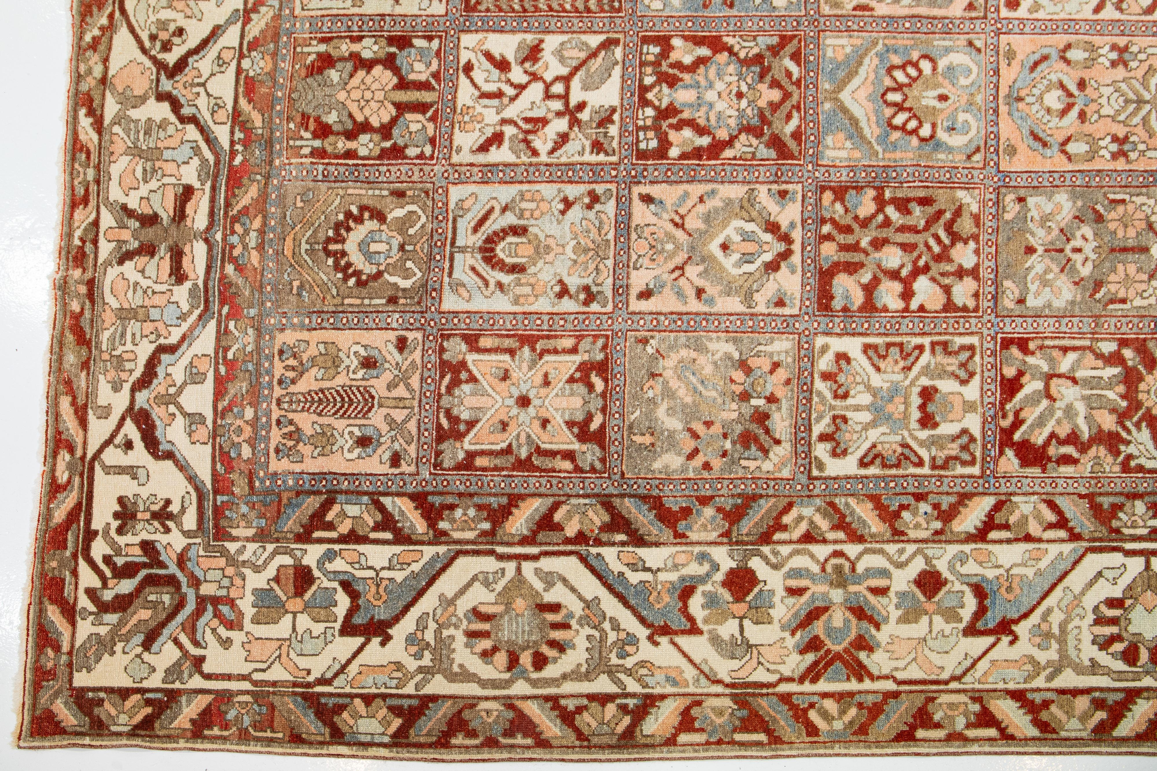 The Floral Persian Bakhtiari Rust Wool Rug Handcrafted in the 1920s (Handgeknüpft) im Angebot