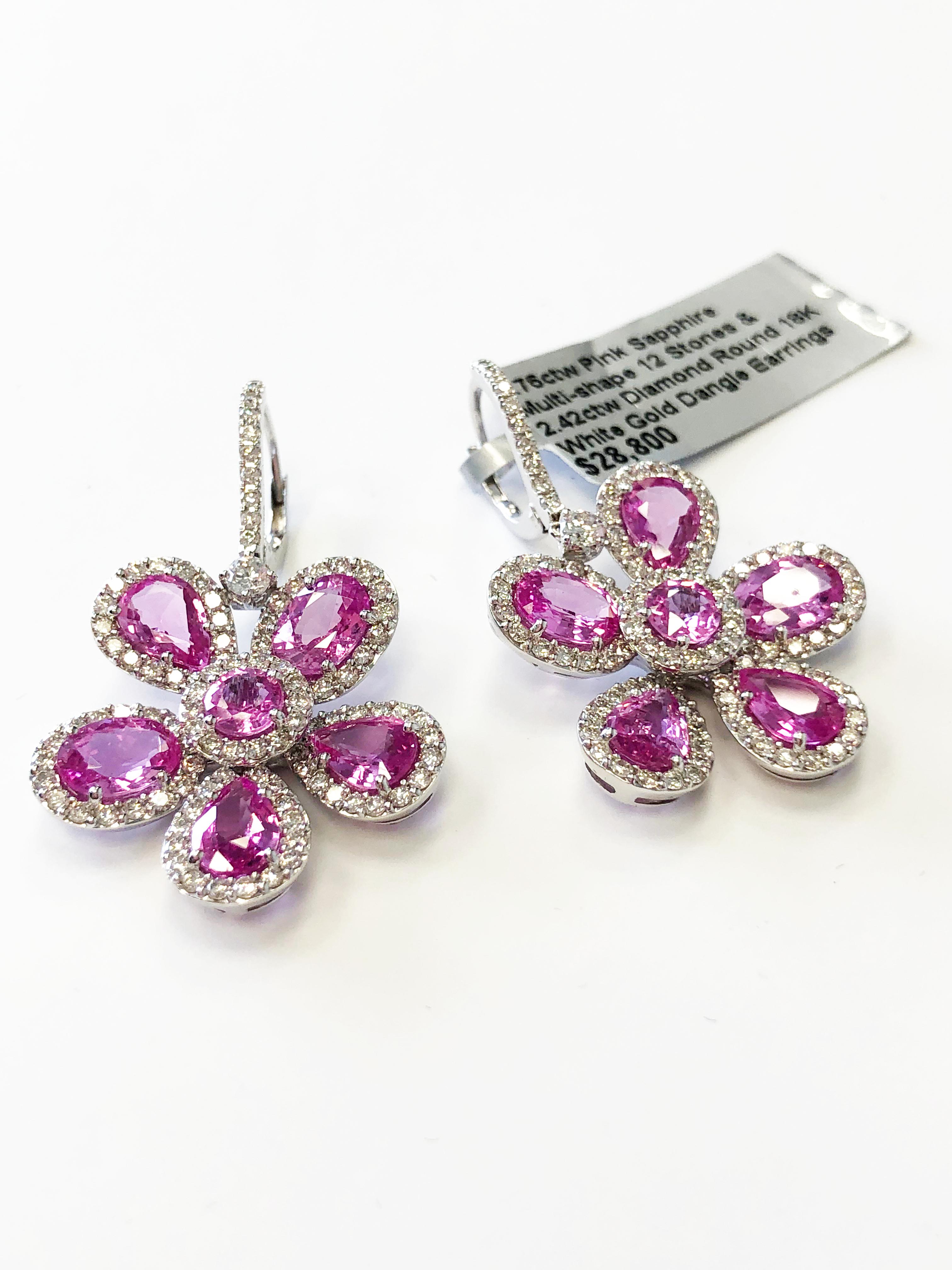 Floral dangle pink sapphire earrings with 8.76 carats of pink sapphires and 2.42 carats of bright white diamonds in handmade 18k white gold mountings.  Simple and classic design perfect for any occasion.  Lightweight and easy to wear!

