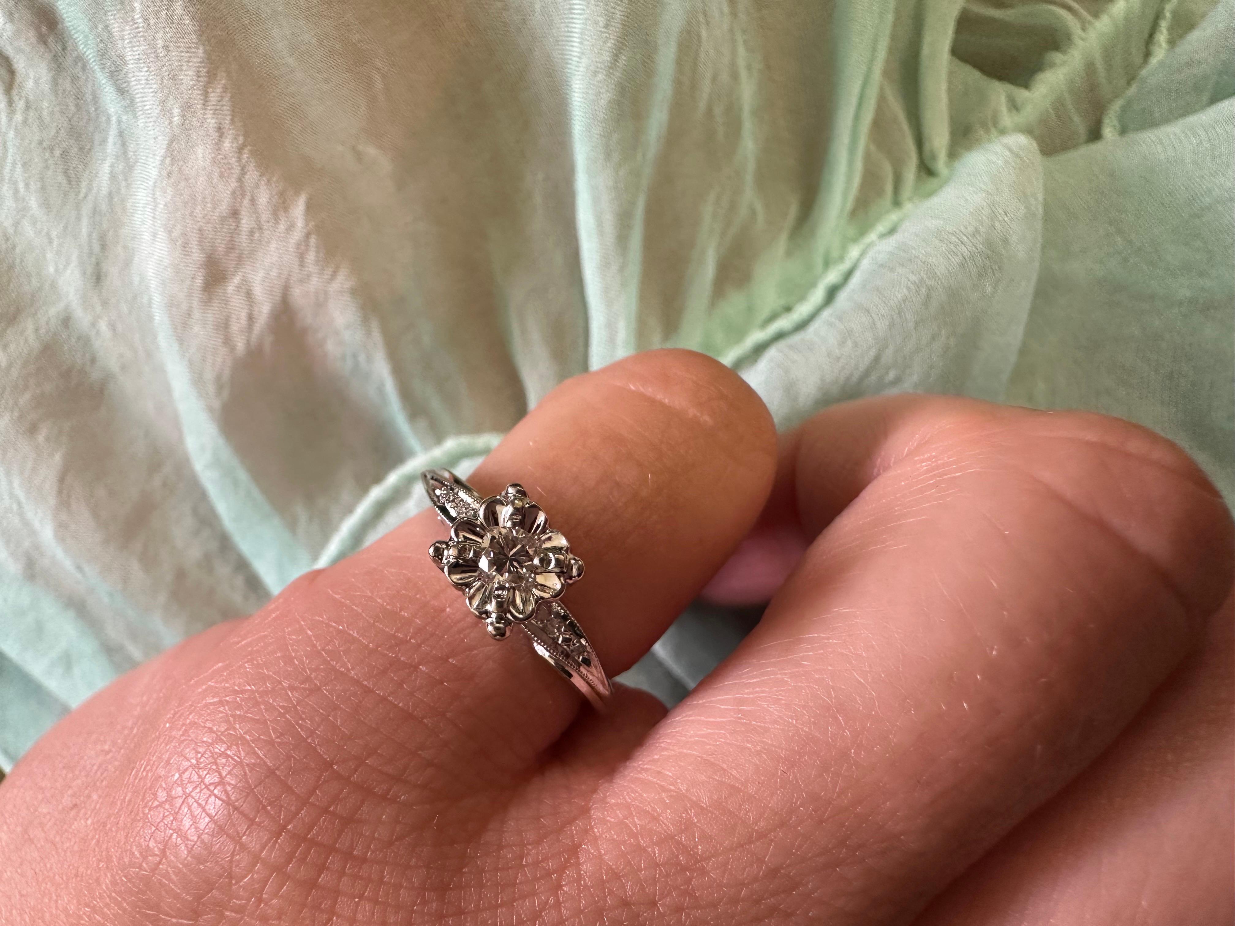 Platinum ring made with floral hand finish and a single diamond, age is unknown, size is 4 and can be re-sized!

Natural Center Diamond(s): 
Color: G
Cut:Round
Carat: 0.05ct
Clarity: SI2
Grams: 2.9
Item: TNA
Certificate of authenticity comes with