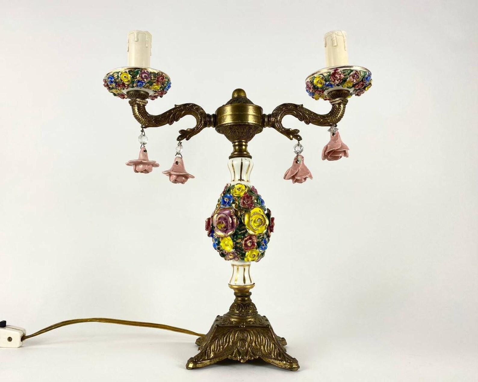 This Stunning brass table lamp is an excellent example of a harmonious combination of quality traditions honed over the years with modern technological capabilities.

The metal parts are painted in the noble gold color , and it is made of