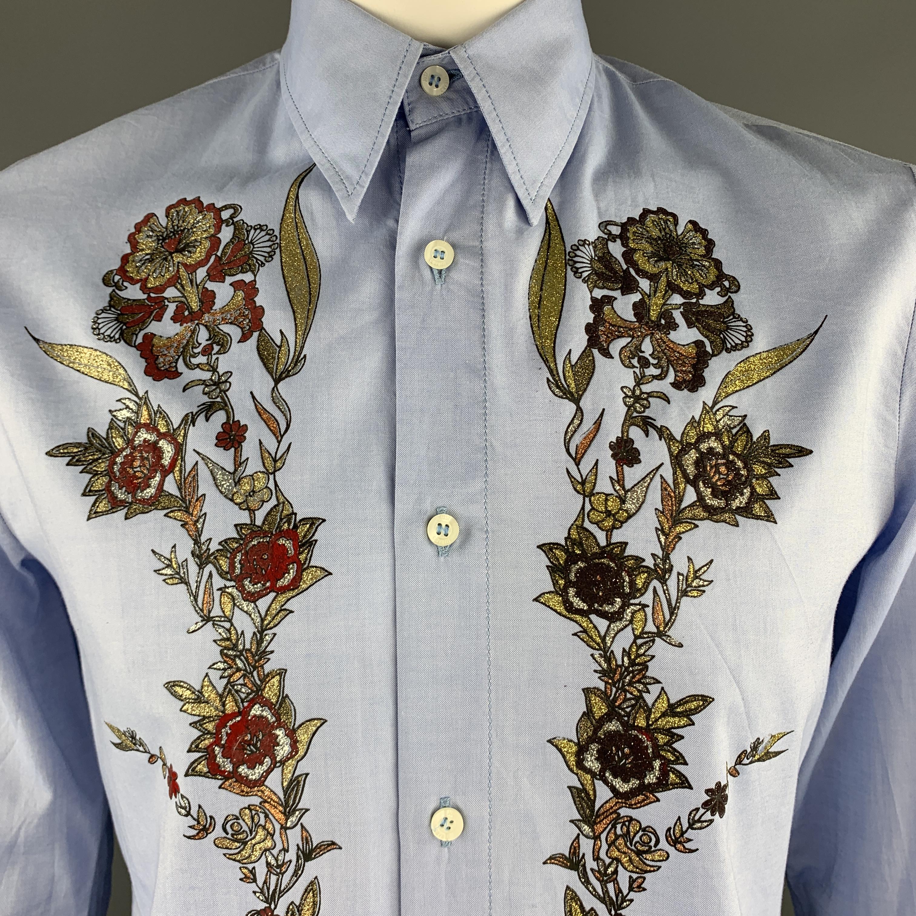 JUST CAVALLI long sleeve shirt comes in a light blue cotton featuring a red and gold front floral glitter embellishment, button up style, and a spread collar.

Excellent Pre-Owned Condition.
Marked: XXL

Measurements:

Shoulder: 19 in.
Chest: 44 in.