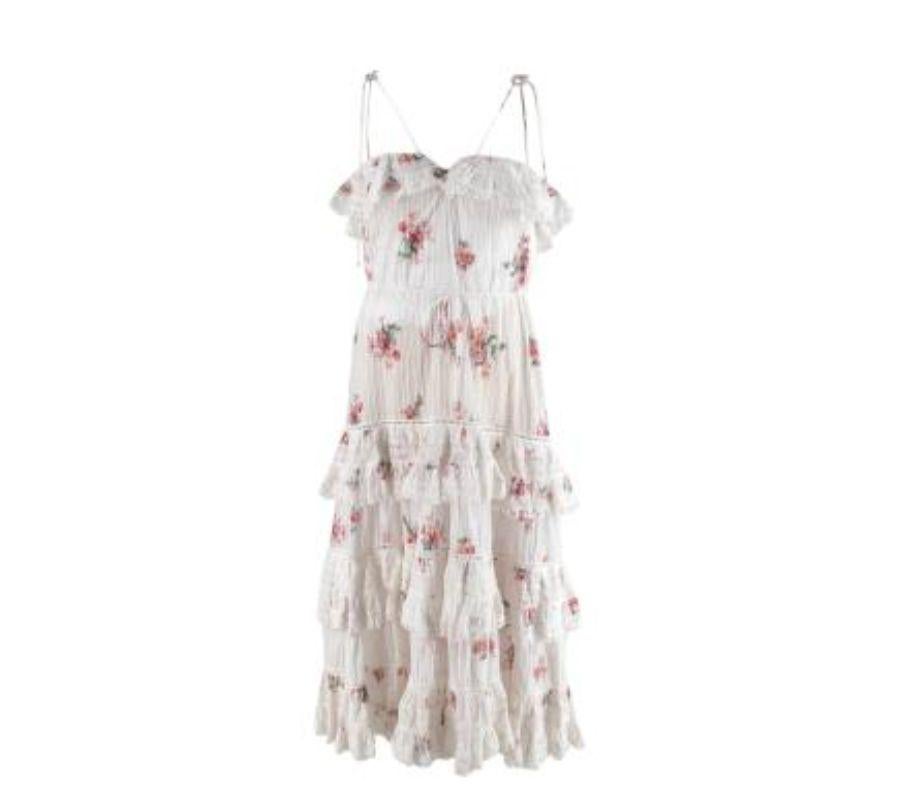 Zimmermann Heathers Floral-Print Pintucked Sundress
 
 - Pink floral print scattered over the dress
 - Lightweight, soft cotton voile with pin tucking detail throughout
 - Tiered body with lace trim
 - Shoestring straps and self-tie belt
 
