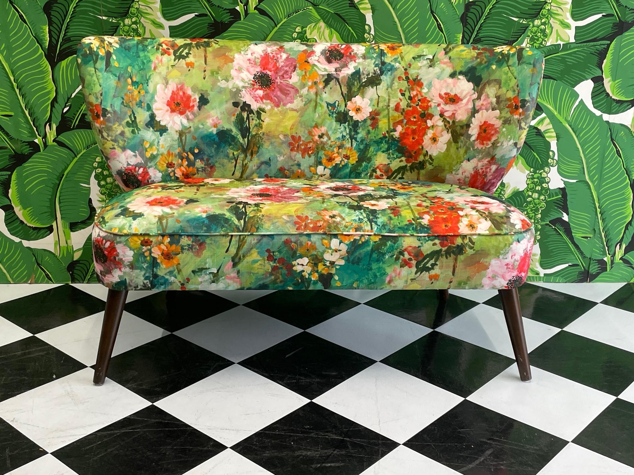 Mid century style settee features a bright floral upholstery and splayed tapered legs. Good condition with minor imperfections consistent with age, see photos for condition details.
For a shipping quote to your exact zip code, please message us.
