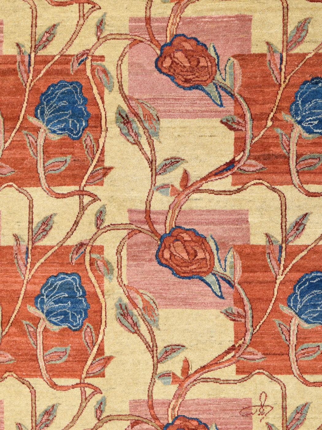 Welcome this 4' x 6' floral red, pink, blue, and cream wool Orley Shabahang Persian rug into your home. As serene as looking upon a scene of lush roses snaking their way around a trellis, 