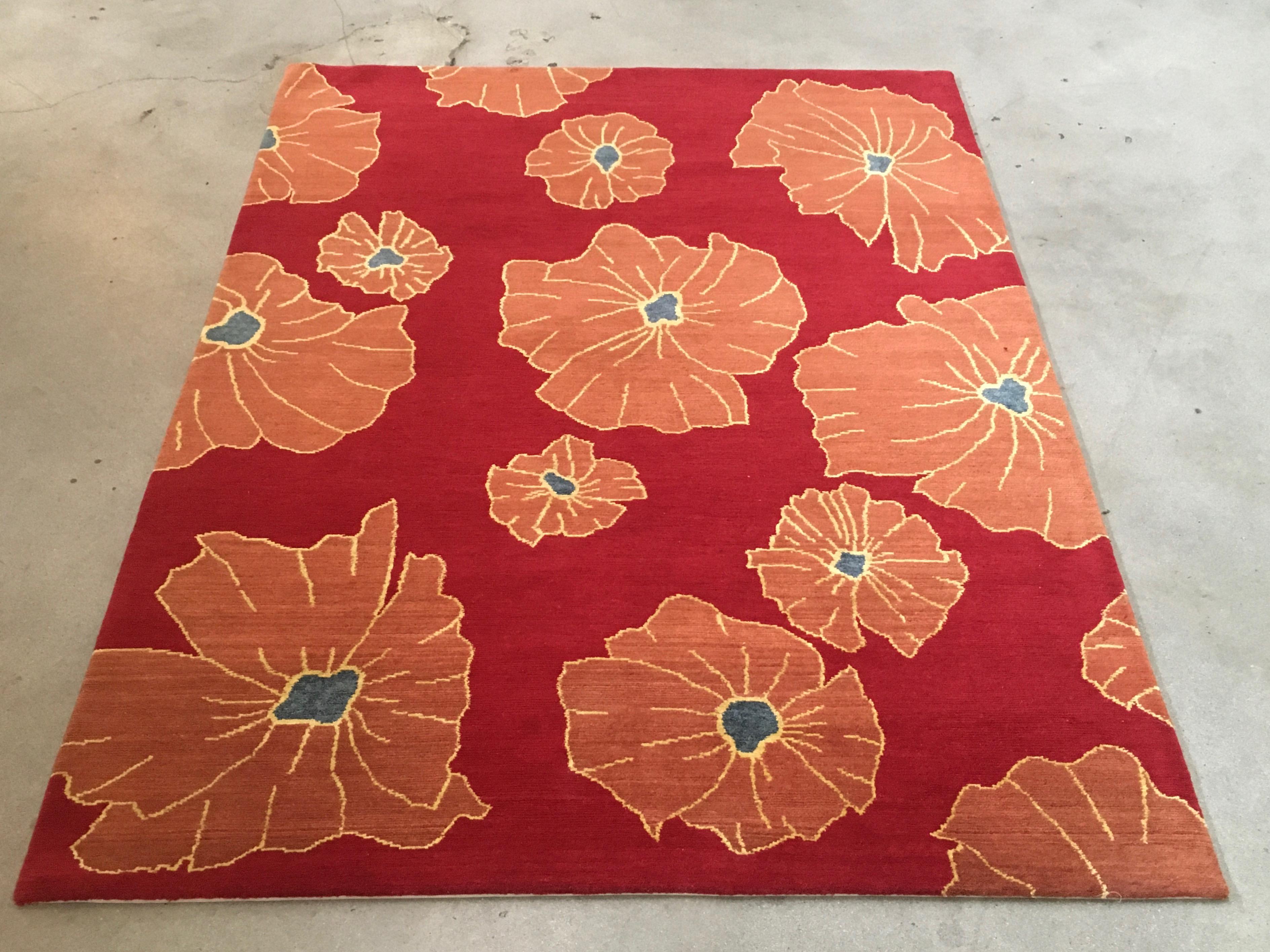 Floral red rug
Colors: Red, rust, orange, blue and cream.