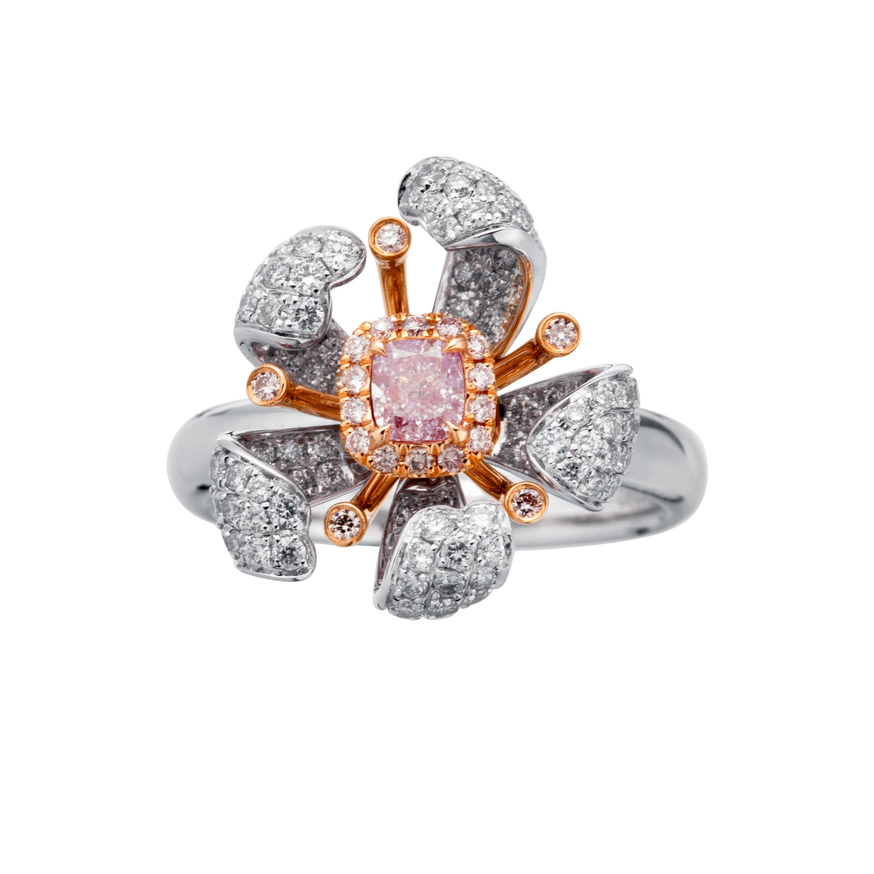Introducing an exquisite 18k white gold floral ring, a true masterpiece of luxury and elegance. This engagement ring features a captivating Fancy Pinkish Purple diamond at its center, weighing 0.26 carats, making it an ideal proposal ring. This