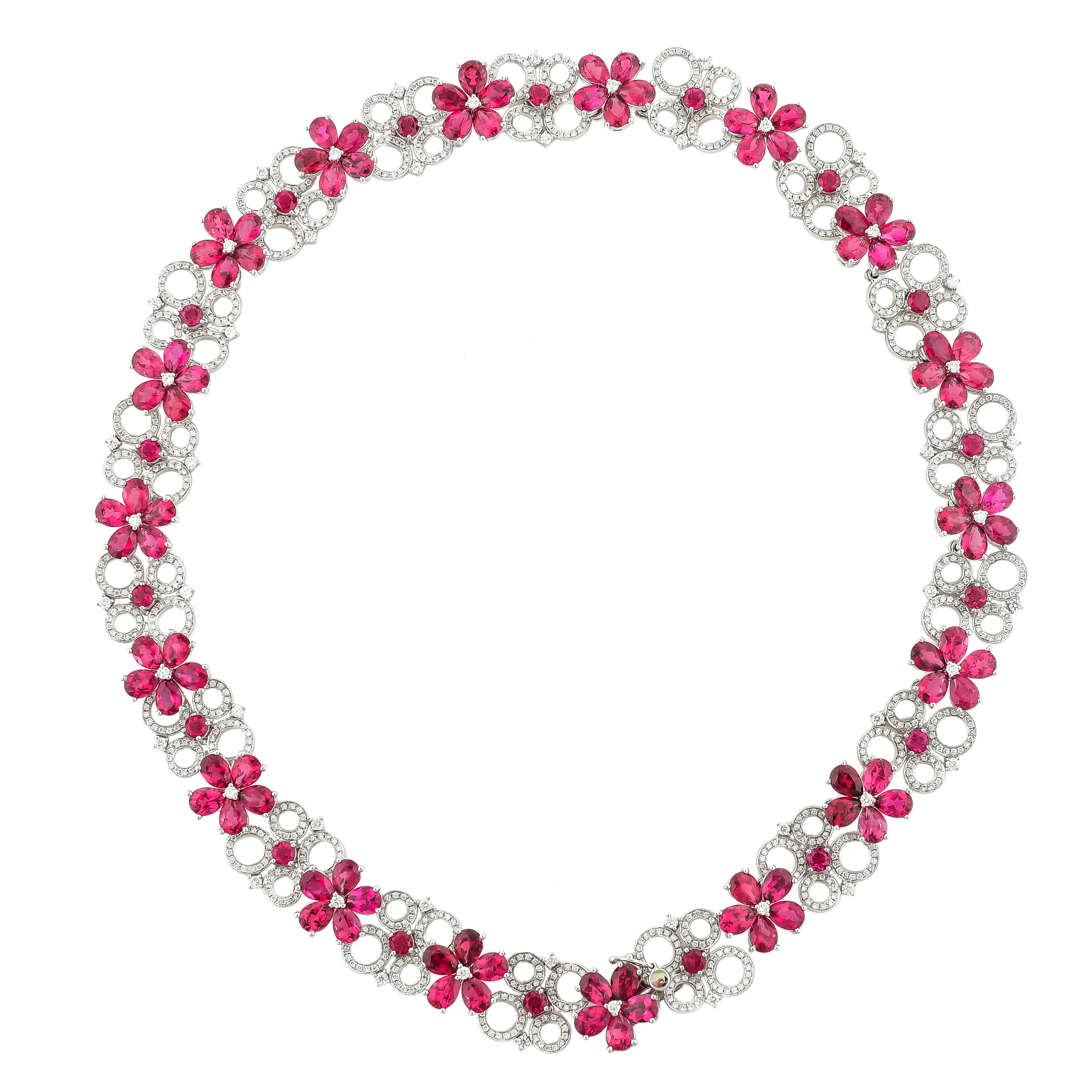 This elegant necklace uses vibrant pinkish red rubelite tourmalines to create a stunning floral garland necklace. The floral motifs are intertwined with diamond links to create a unique and exclusive piece. Exclusively design by Sunita Nahata Fine