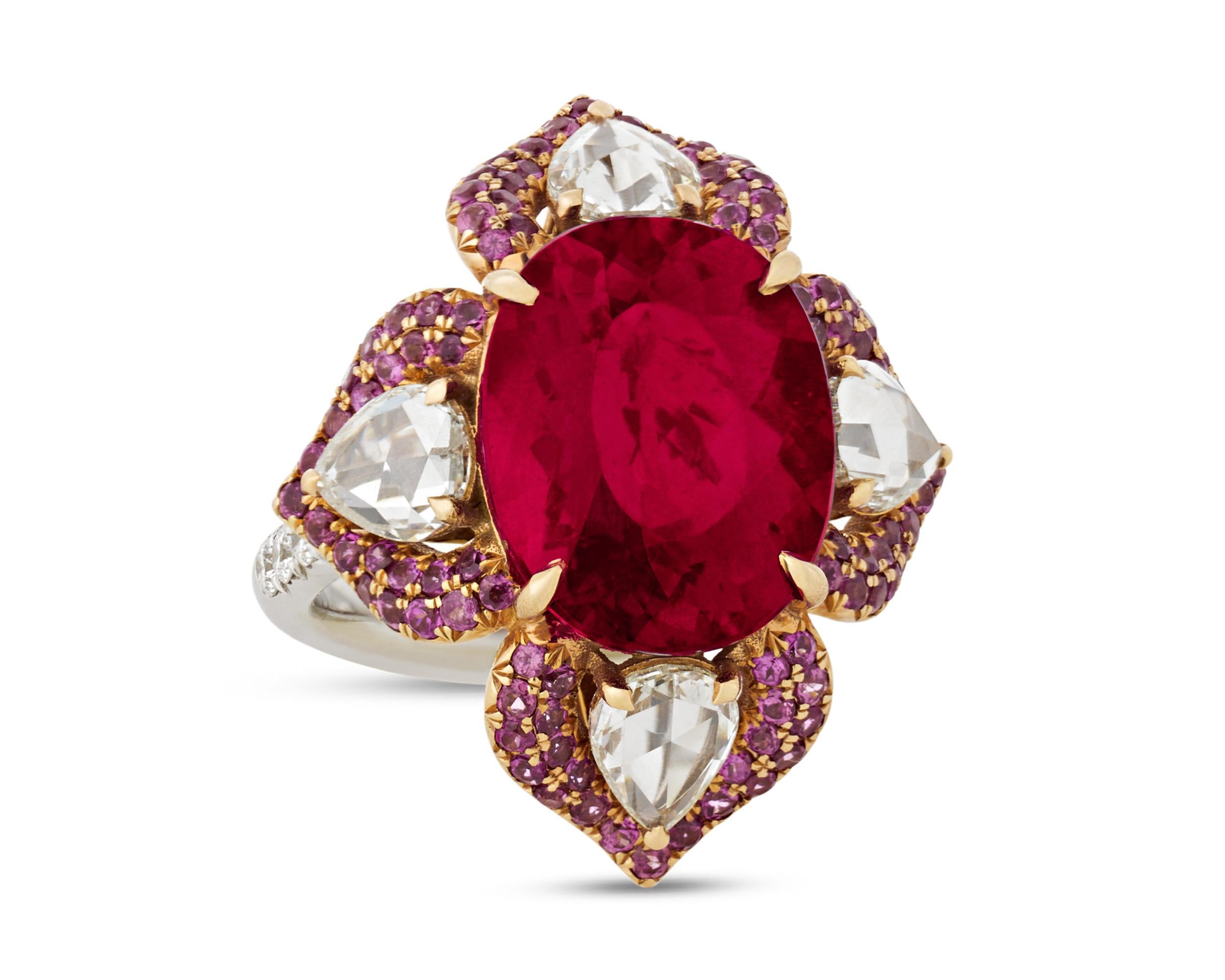 The gems of this visually striking ring come together to form a deep red floral motif. The large central rubellite tourmaline totals 9.41 carats, and displays its coveted vibrant and rich red hue. Accented by 1.37 carats of pink garnets and 0.21