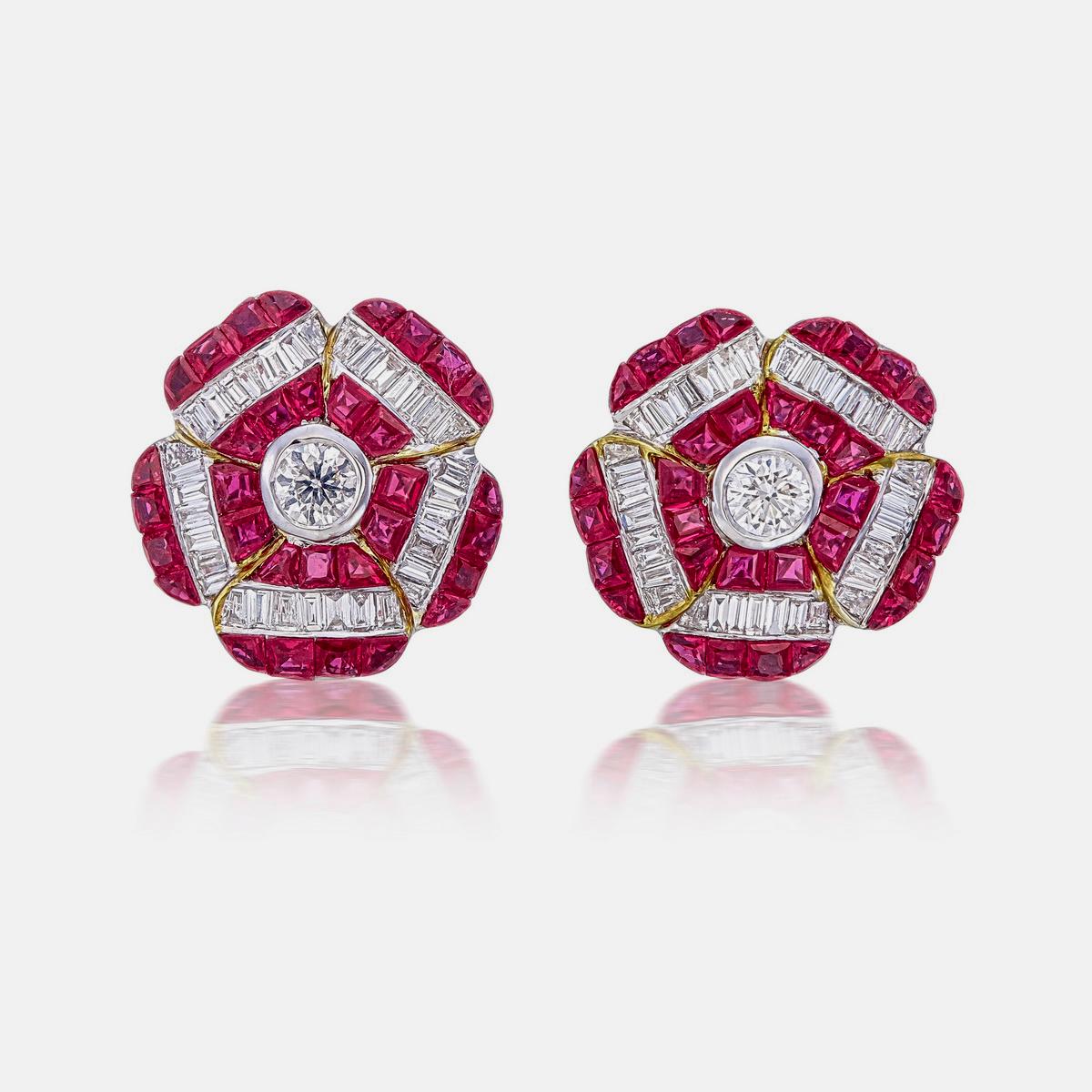 A pair of fine modern ruby and diamond floral earrings made in 18 Karat gold. A great choice for lifestyle wear.

- There are two center diamonds with the total weight of 0.24 carats
- There are seventy tapered-baguette supporting diamonds,