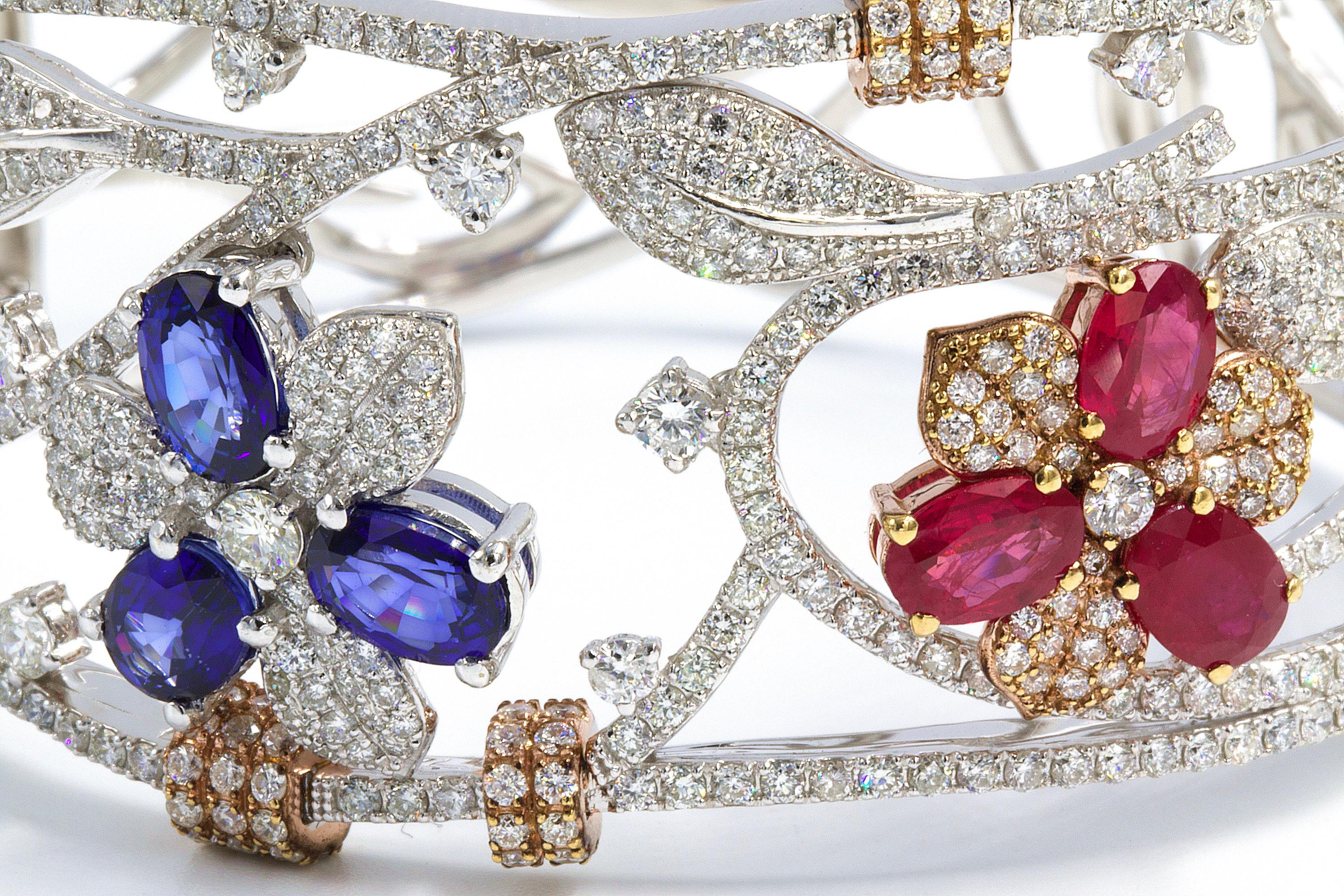 Hand Crafted, exceptional bangle bracelet, with very fine sapphires and rubies. Very LUX, and fine.  
18K Gold
4.46 Carats Fine Rubies
3.36 Carats Sapphires
6.50 Carats Diamonds ( Clarity: F-VS )