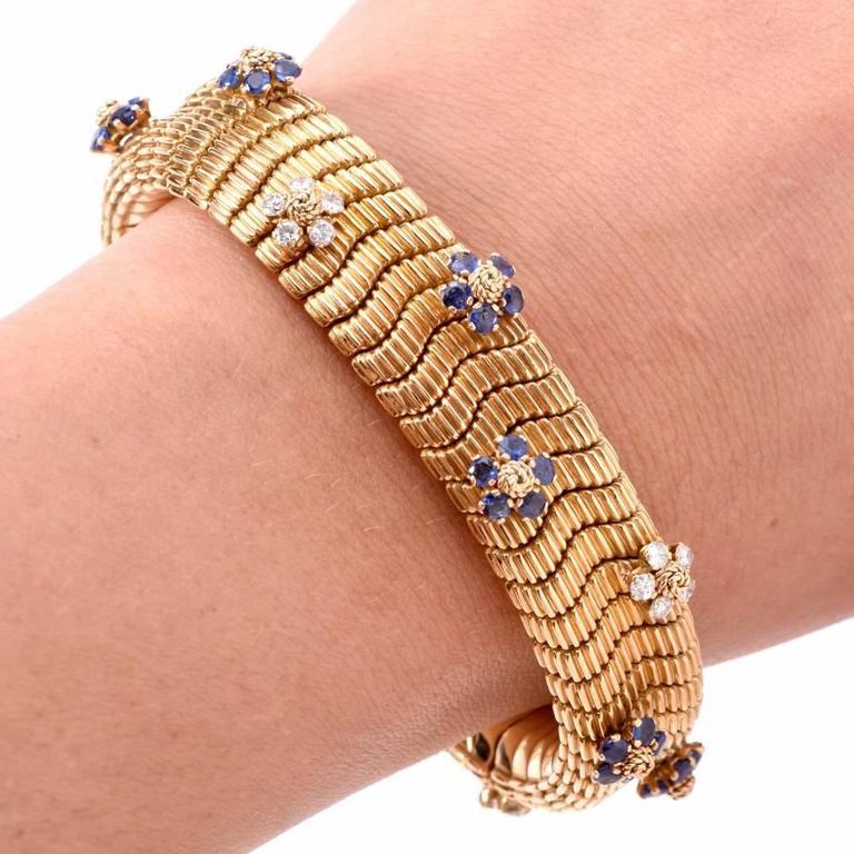 This conspicuous Retro bracelet of immaculate design and craftsmanship is constructed in solid 18K yellow gold, artfully textured on both sides to simulate the anatomically accurate pattern of snake scales. The double-faceted, skin-friendly bracelet