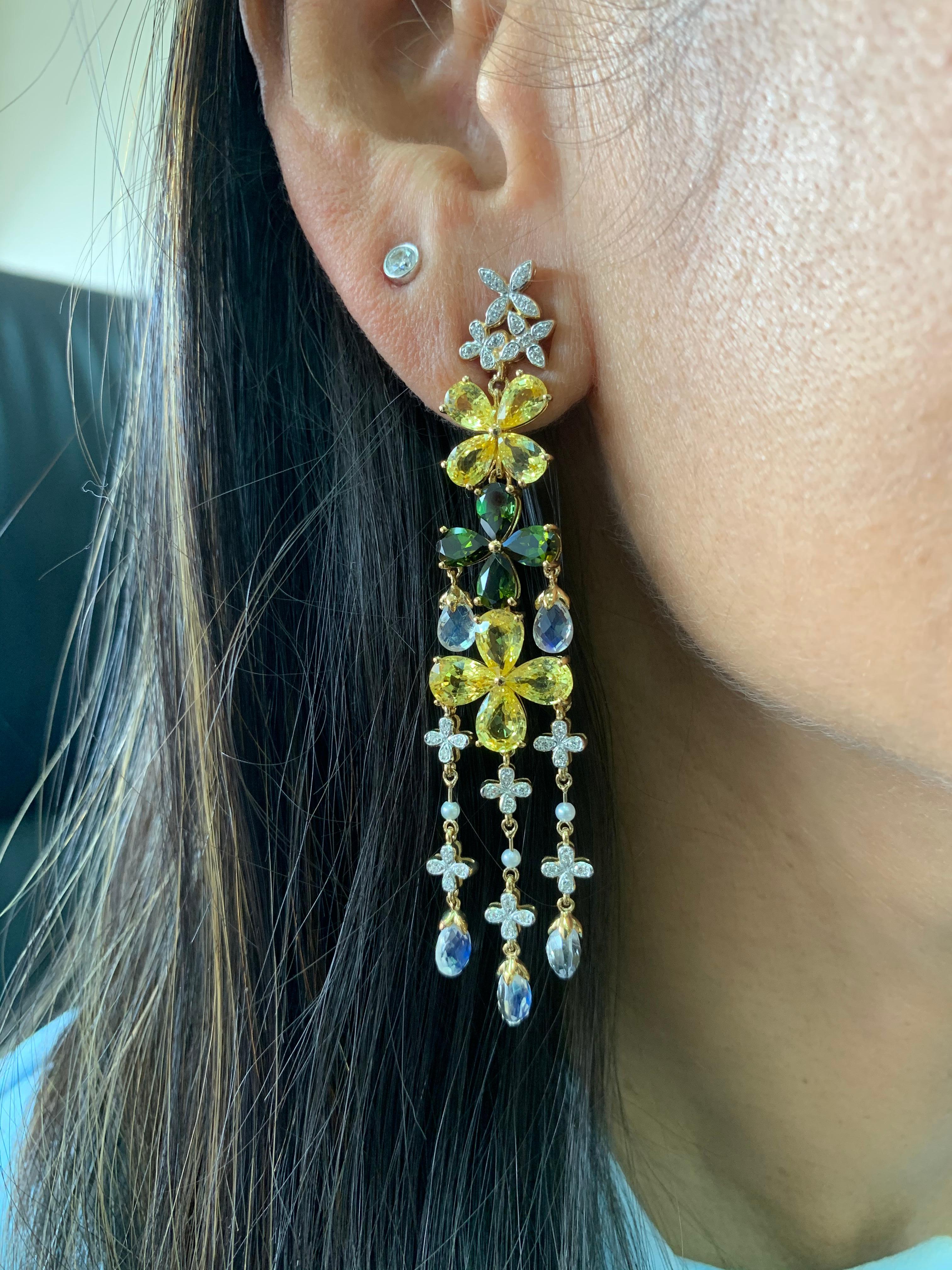 This earring is part of the exclusive Floral Fantasy Collection presented by Sunita Nahata. These simple floral designs are given an elegant touch with the multi layered architectural construction of the pieces. In addition, these rings are accented