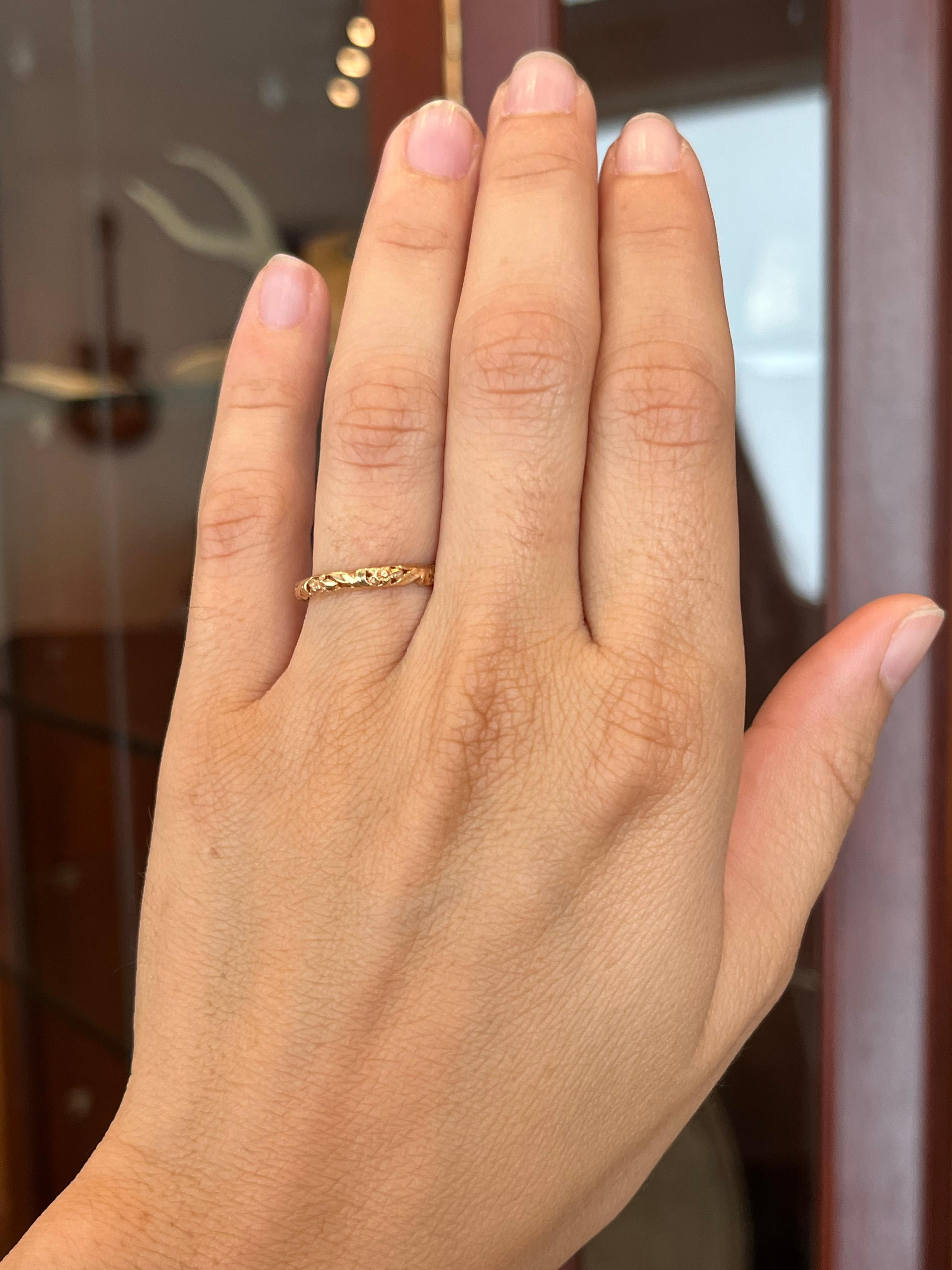 Crafted by Bracken Jewelers in Santa Monica, California. This 18K rose gold wedding band features a sculpted floral pattern. It is a vintage-inspired design. Stacks beautifully next to an engagement ring with a plain band or one that boasts a