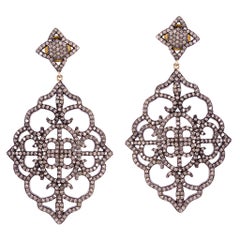 Pendants d'oreilles en or et argent avec diamants pavés de forme florale