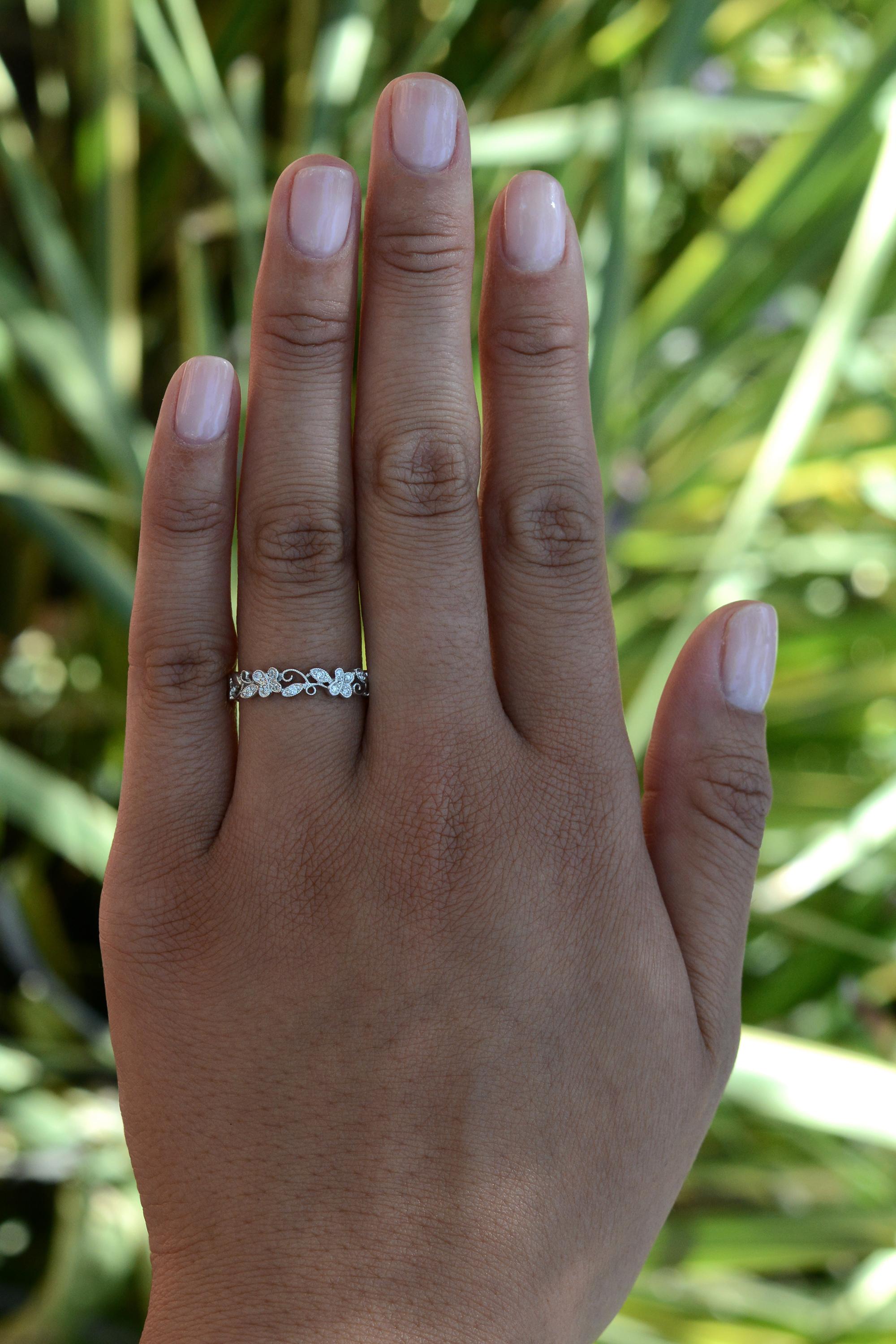 Look no further for your timeless diamond wedding band ring, sure to be a staple in your treasure chest with its slender chic fit and summery energy. This tasteful designer band is a lovely and light contemporary choice. With its intricate