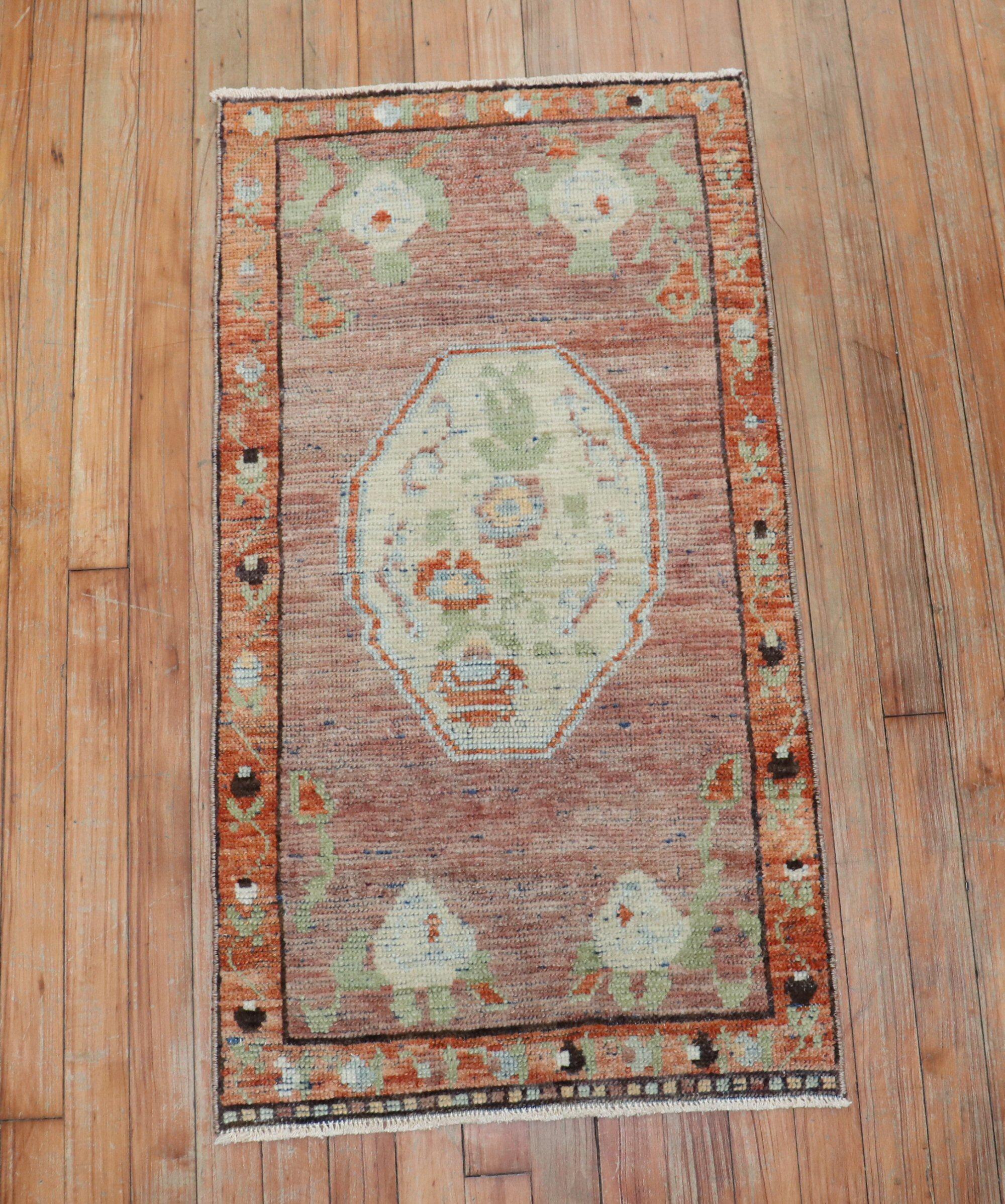 Vintage Turkish Yastik rug with peach, ivory, and green accents and a floral motif

Measures: 21