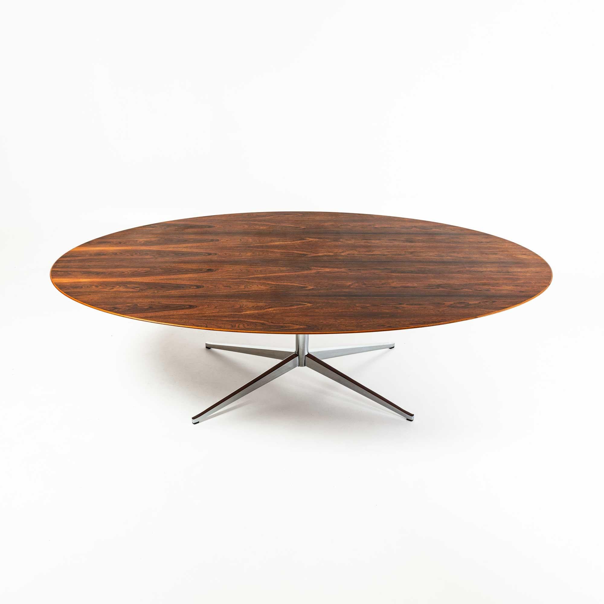 A 96 inch oval Florence Knoll desk/dining table for Knoll International, 1970s, with rosewood veneer top, in overall great condition.

The legs have been rechrome and the table top lightly refinished.