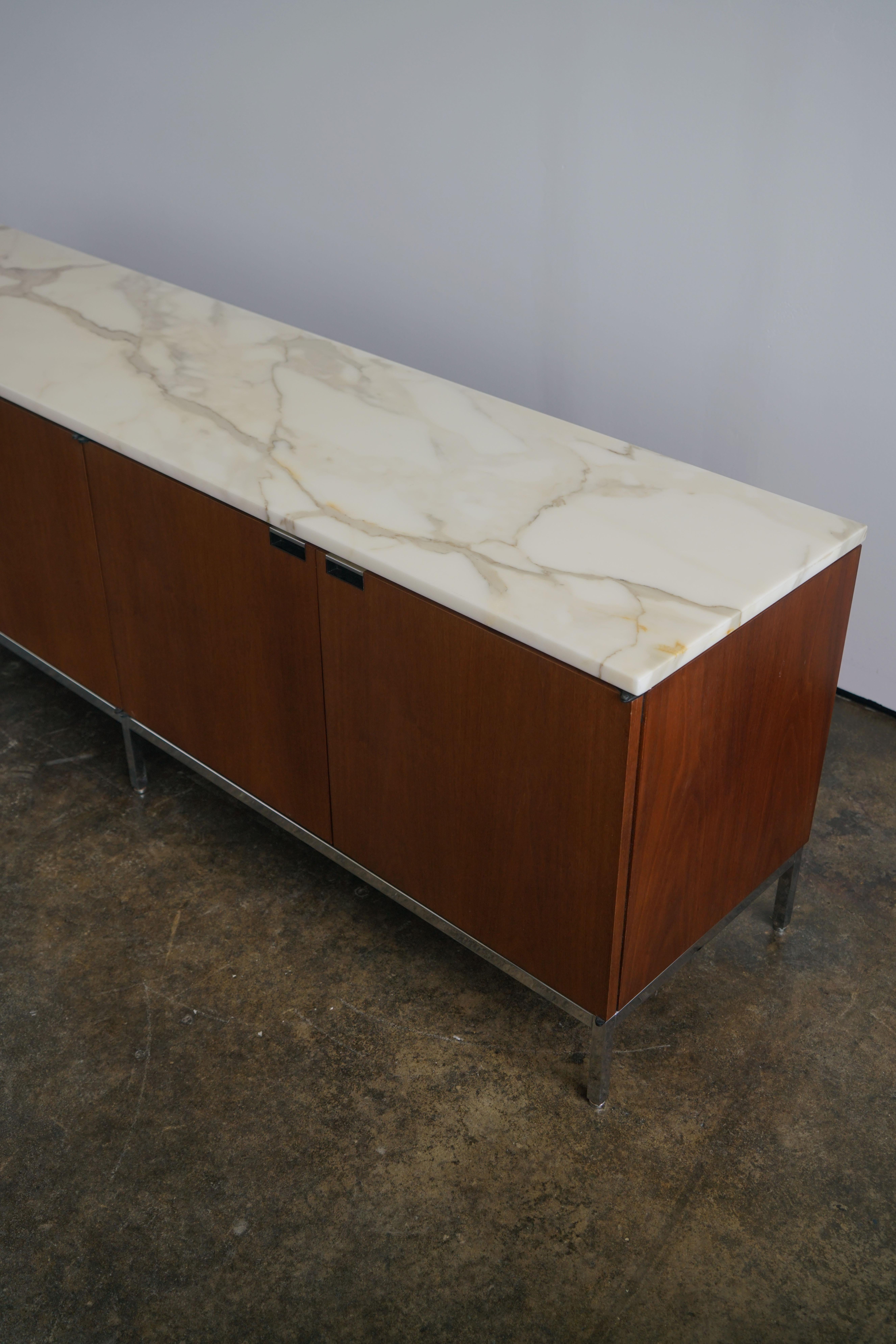 75” x 18.25” x 25.5”H

Medium Brown Mahogany, Carrara marble top, chrome-plated steel legs

8 adjustable shelves

Knoll label

Condition: Very good to excellent. Slight yellowing on marble top over time, but does not detract from the overall