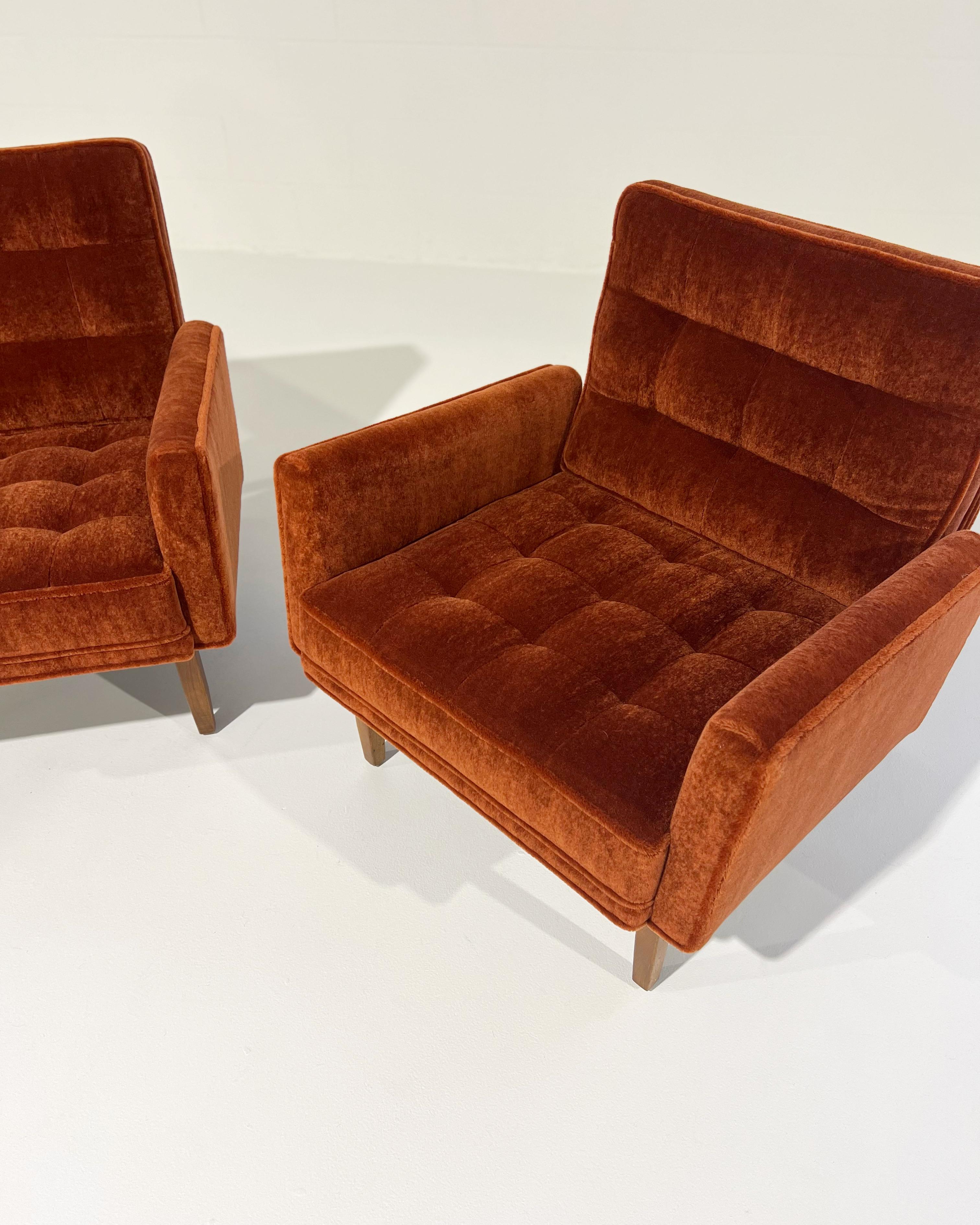 These are so beautiful and so comfortable. We love the architectural lines and geometric profile of this iconic Florence Knoll design. This pair is an early example with the walnut legs. Our design team chose a gorgeous Pierre Frey mohair in a deep