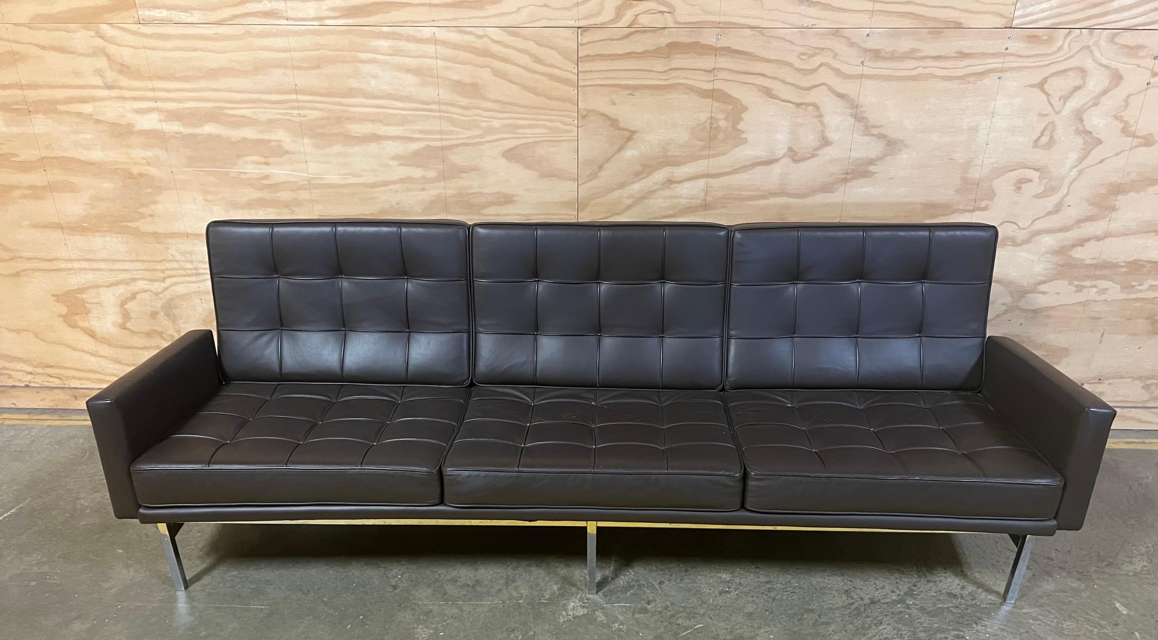 Florence Knoll three seat sofa by Knoll Associates.  Model 2577.  Original Naugahyde brown upholstery with chrome-plated steel base.  

Unsigned. 

USA, circa 1960-1970.

Dimensions: 90.75” L x  27” D x 29.5” H

Provenance: Private Collection, East