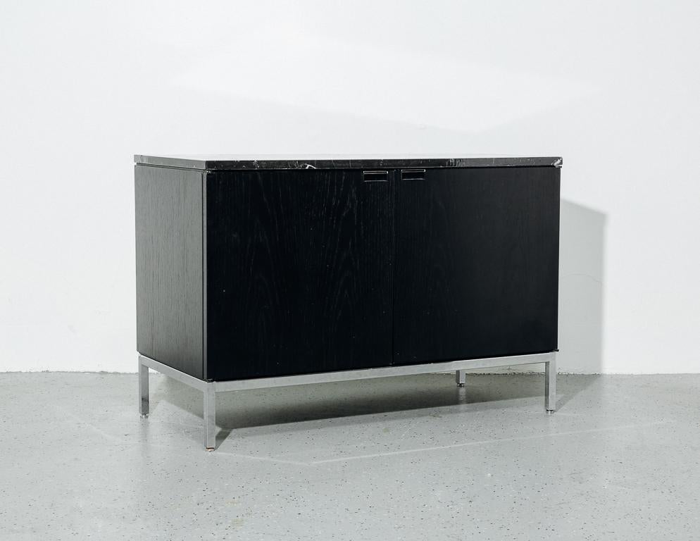 black cabinet with marble top