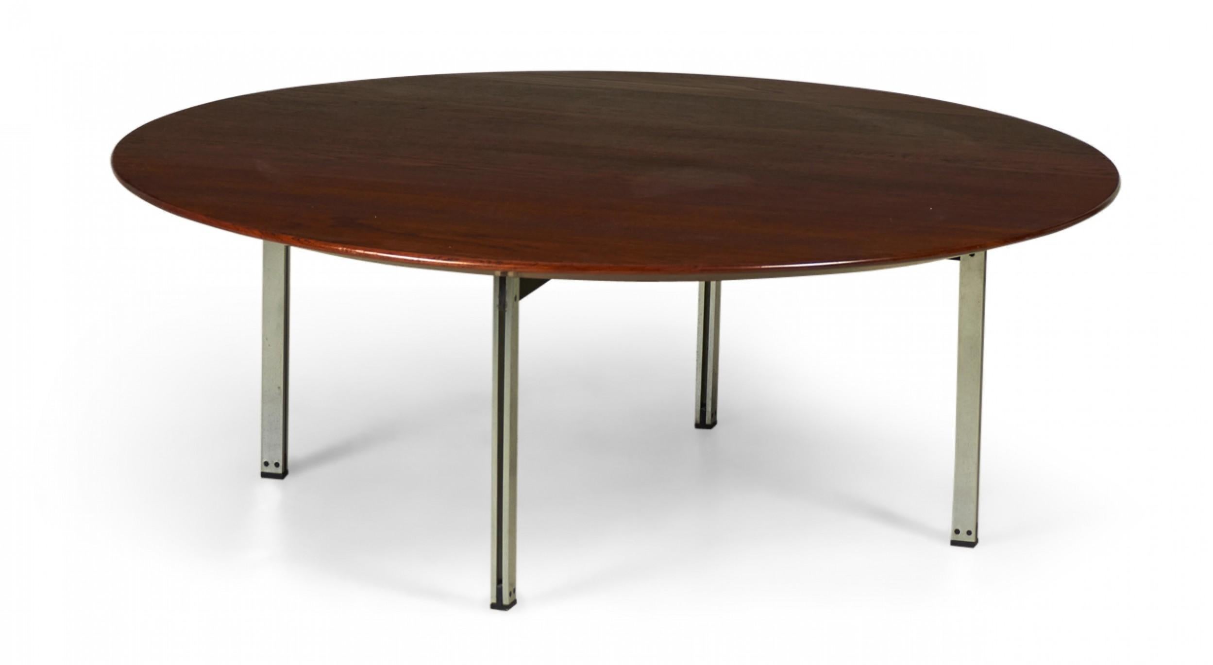 American Mid-Century 'Parallel Bar' cocktail / coffee table with a circular walnut top supported by three satin chrome-plated steel legs. (Florence Knoll).
    