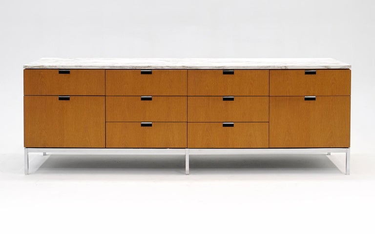 Florence Knoll credenza in oak with Carrara marble top and chromed steel frame. This is one of the best examples of this design to come through our hands in 25 years in business. The book matched oak case has few if any signs of use. The drawers all