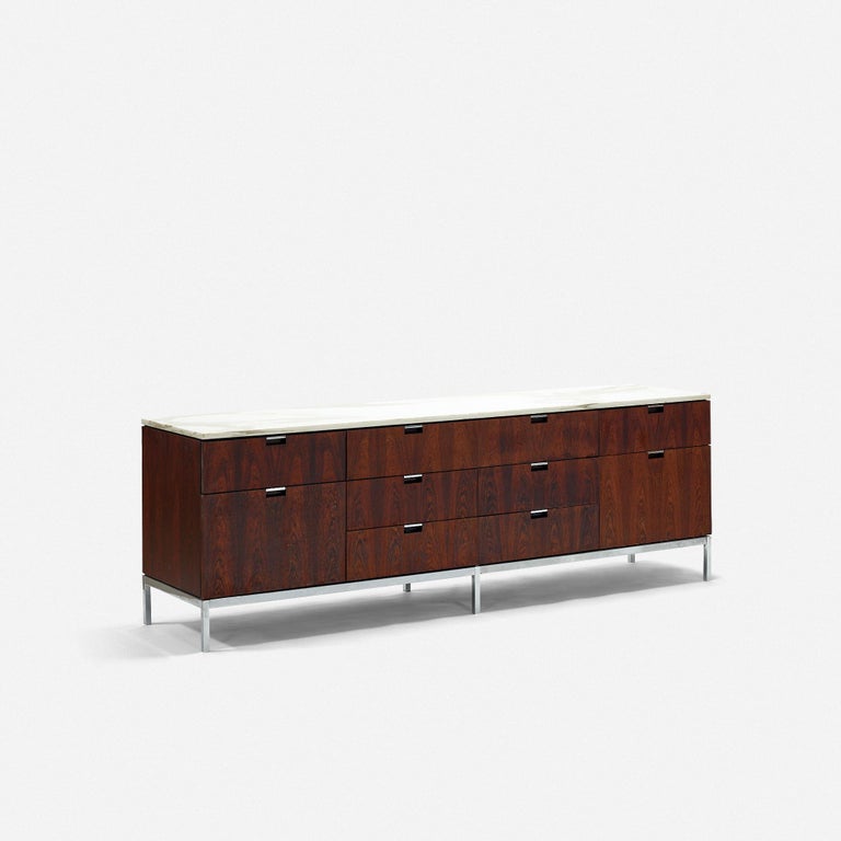 Knoll Associates
Florence Knoll
USA
rosewood veneer, marble, chrome-plated steel
Measures: 75 W × 18.5 D × 25.5 H in

Rosewood has uneven finish. Small veneer loss. Small chips to edges of marble. Loss to marble and some staining.