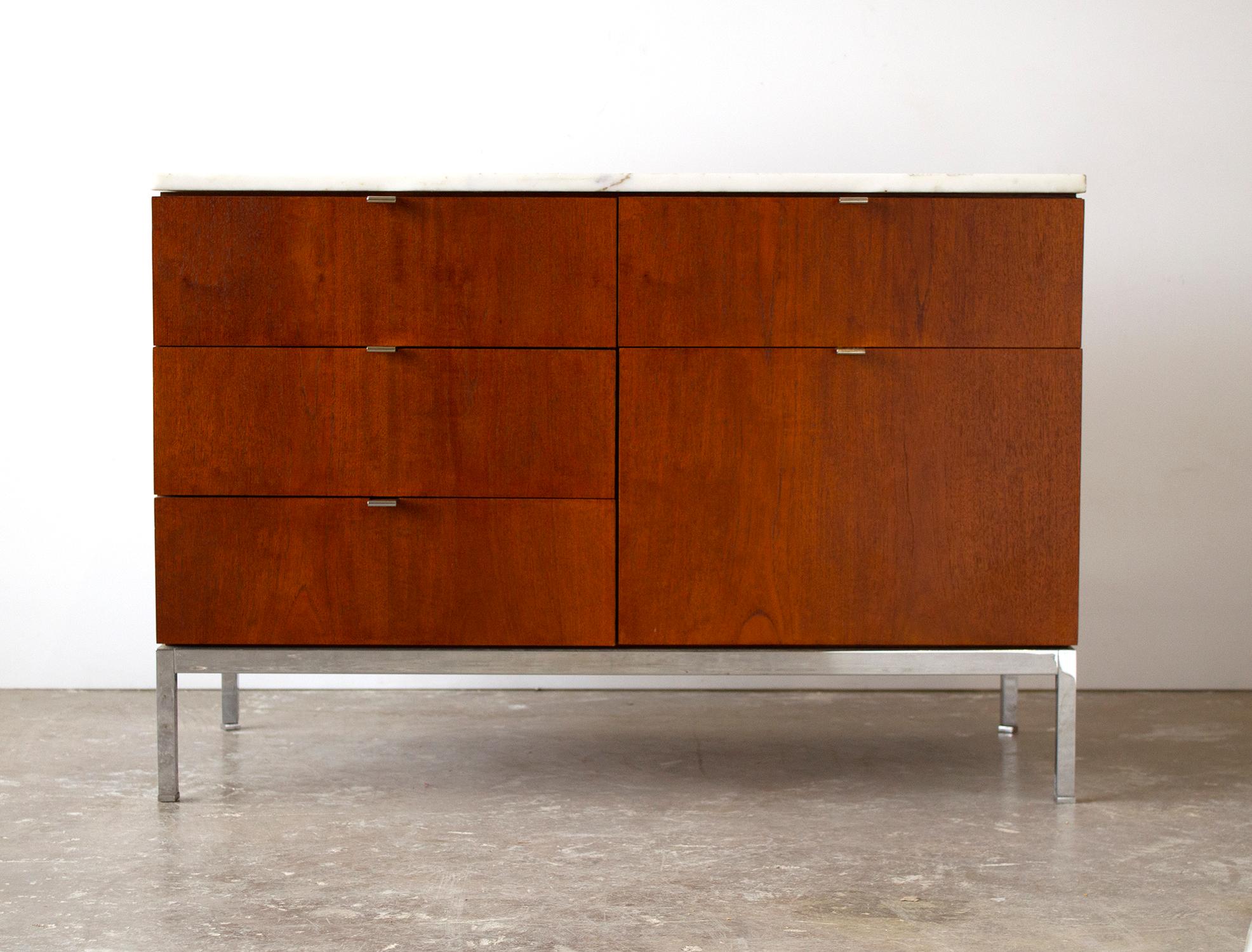 Beautiful five-drawer credenza designed by Florence Knoll for Knoll Internation, 1960s. The credenza is in very good original condition constructed of teak with the original marble top.