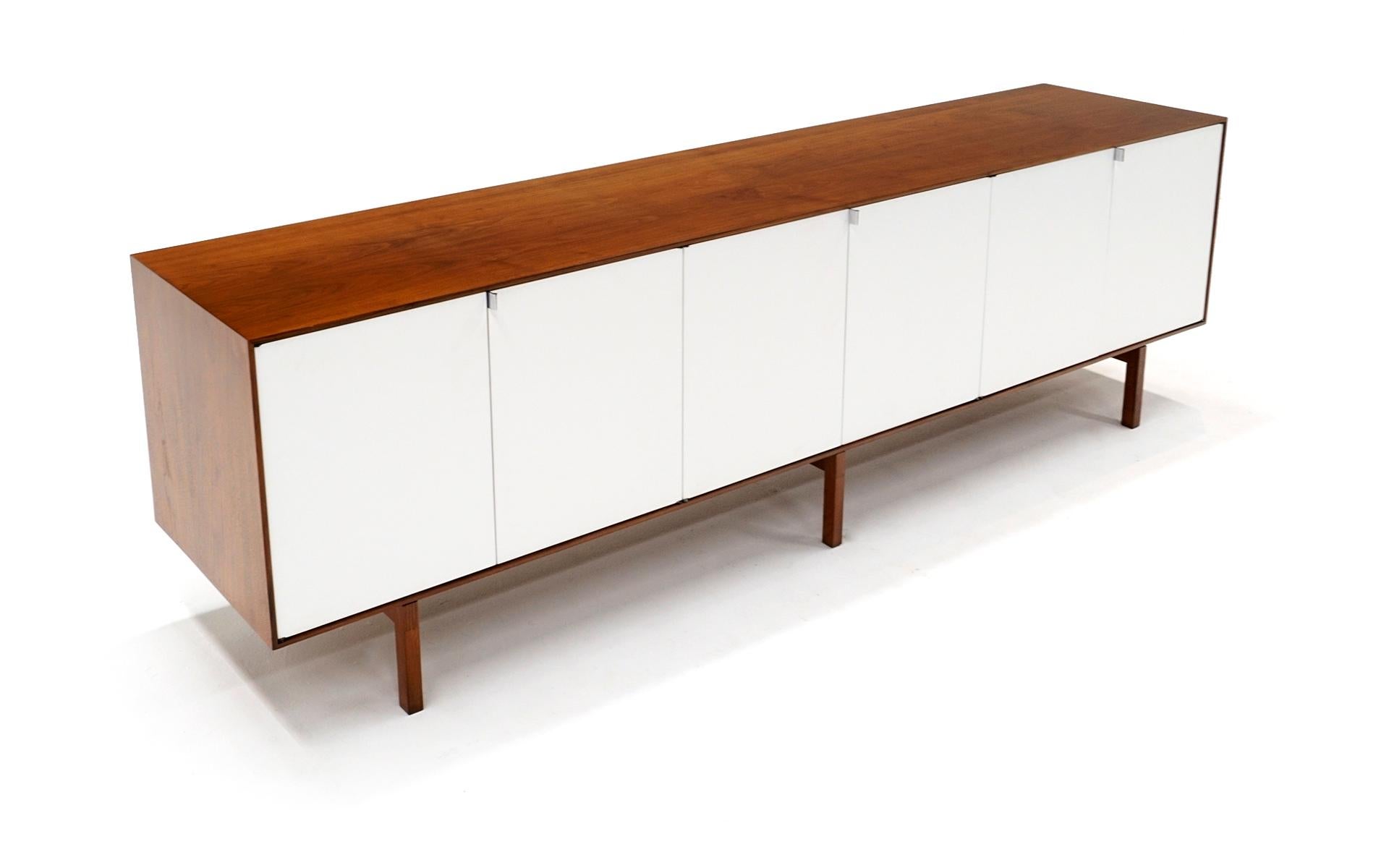 Very rare, likely customer ordered, Florence Knoll walnut and white six door credenza / storage cabinet / sideboard. Expertly restored and refinished, paying attention to every detail. All original hardware, shelves and drawers. Look at the detailed