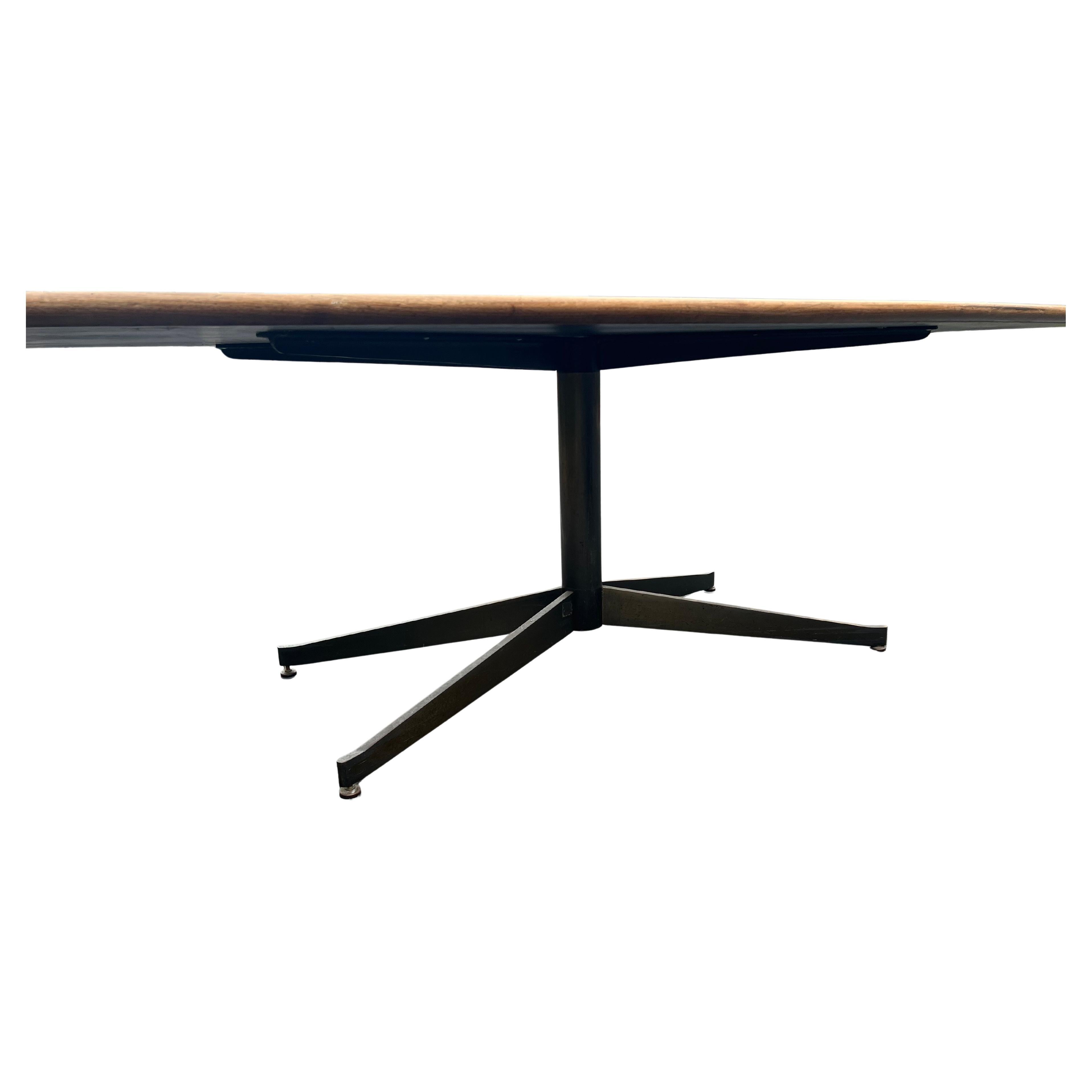 X large Knoll conference table circa 1970s great design can be used like a dining table or desk table, in a patinated bronze finish base and a top with laminated center formica faux walnut wood , with a solid walnut edge beautiful rare solid .