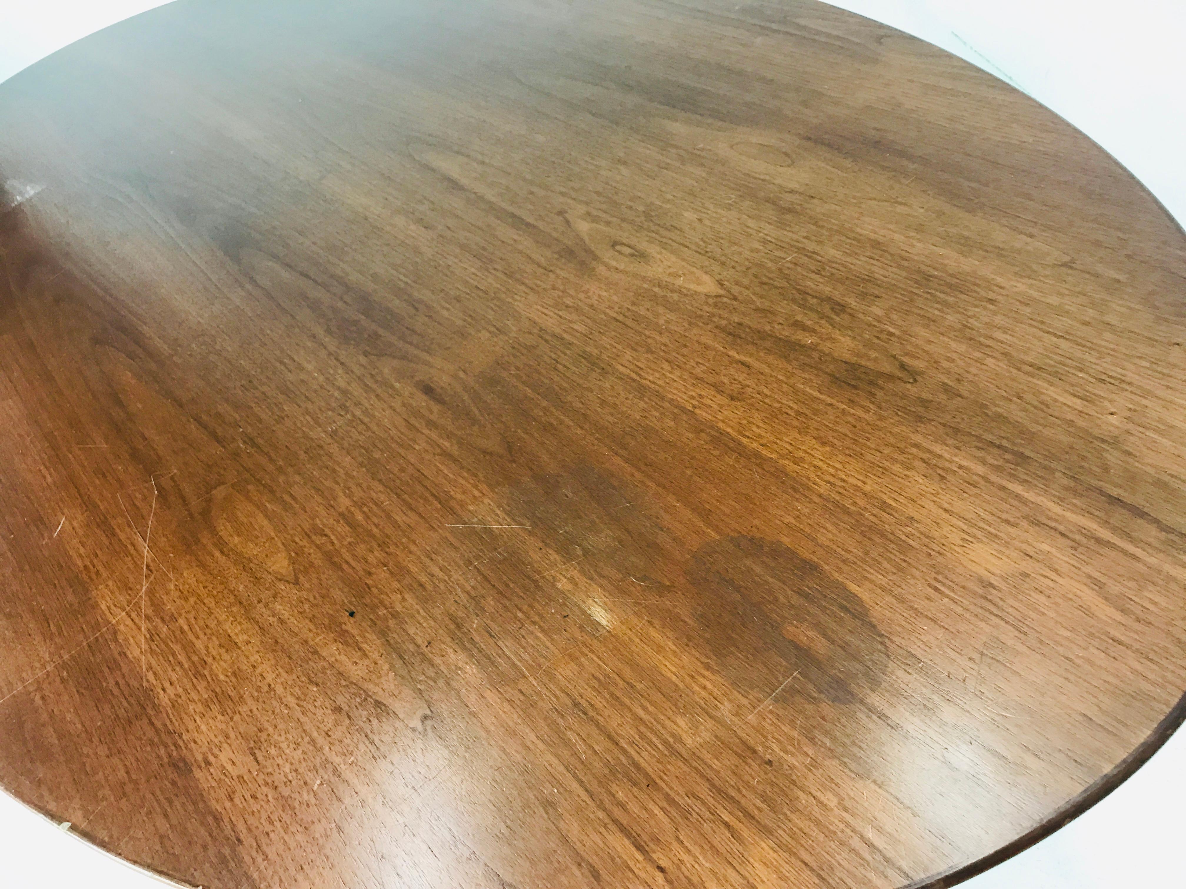 Florence Knoll dining table/desk/conference table.
Top is walnut with beveled edge.
Restoration recommended.