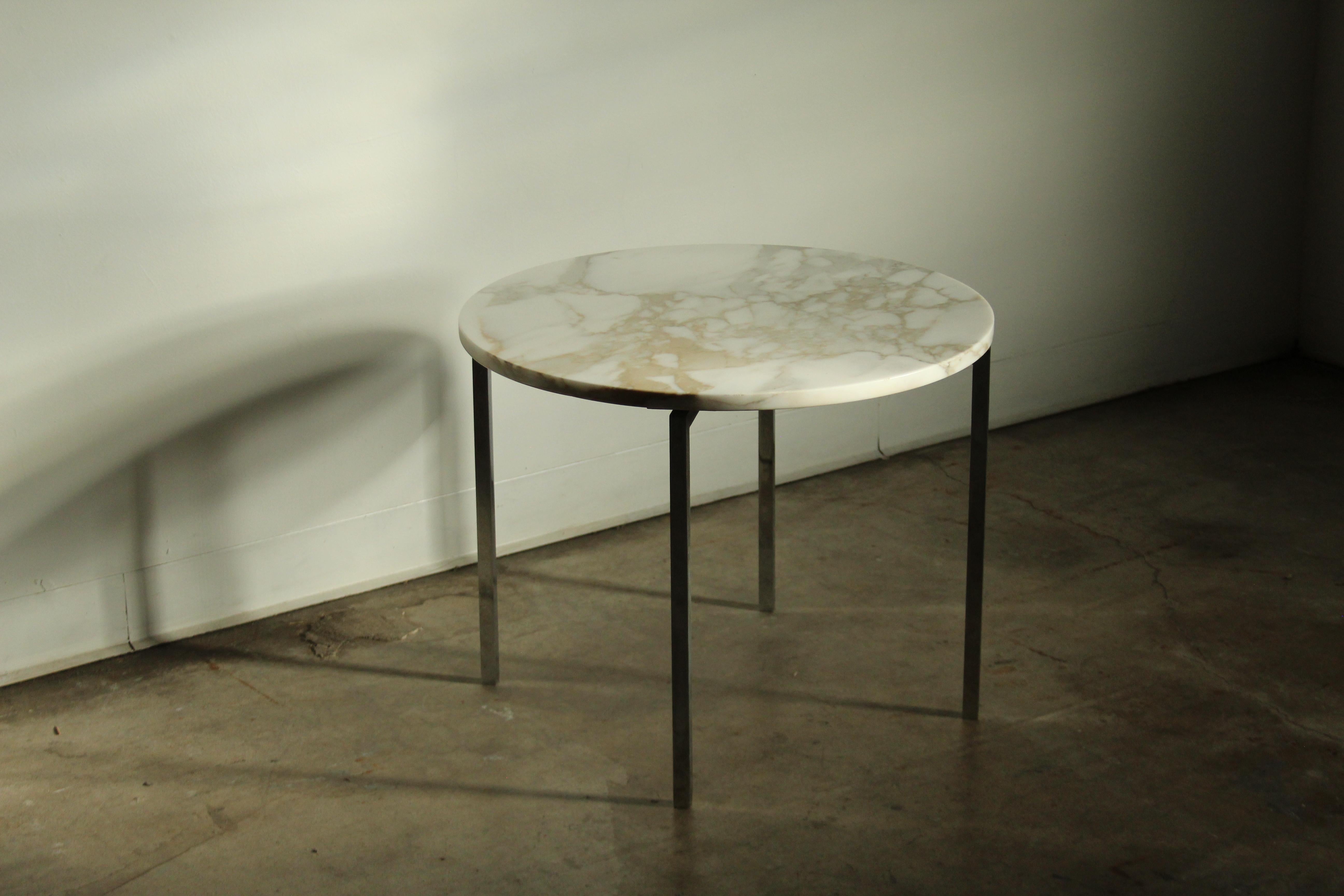 A stunning and early marble side table designed by Florence Knoll and manufactured by Knoll Associates. Delightful scale, perfect as a large side table or also suitable as a small coffee table. The original Calacatta marble top features absolutely