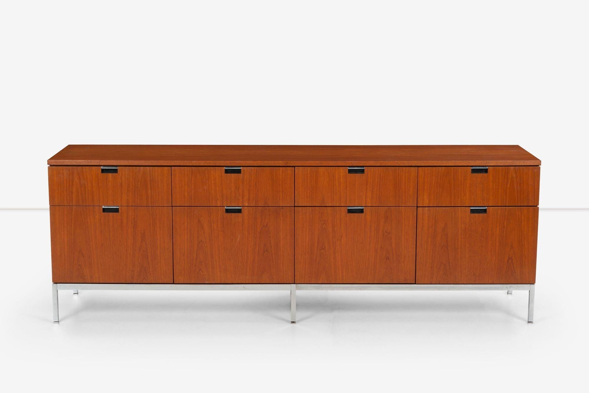 Florence Knoll Eight-Drawer Credenza in Teakwood, features Notch pulls with chrome details, Four file drawers and Four pencil drawers, chrome plated adjustable feet, with lock.
[Knoll label on underside 1976 stamp].