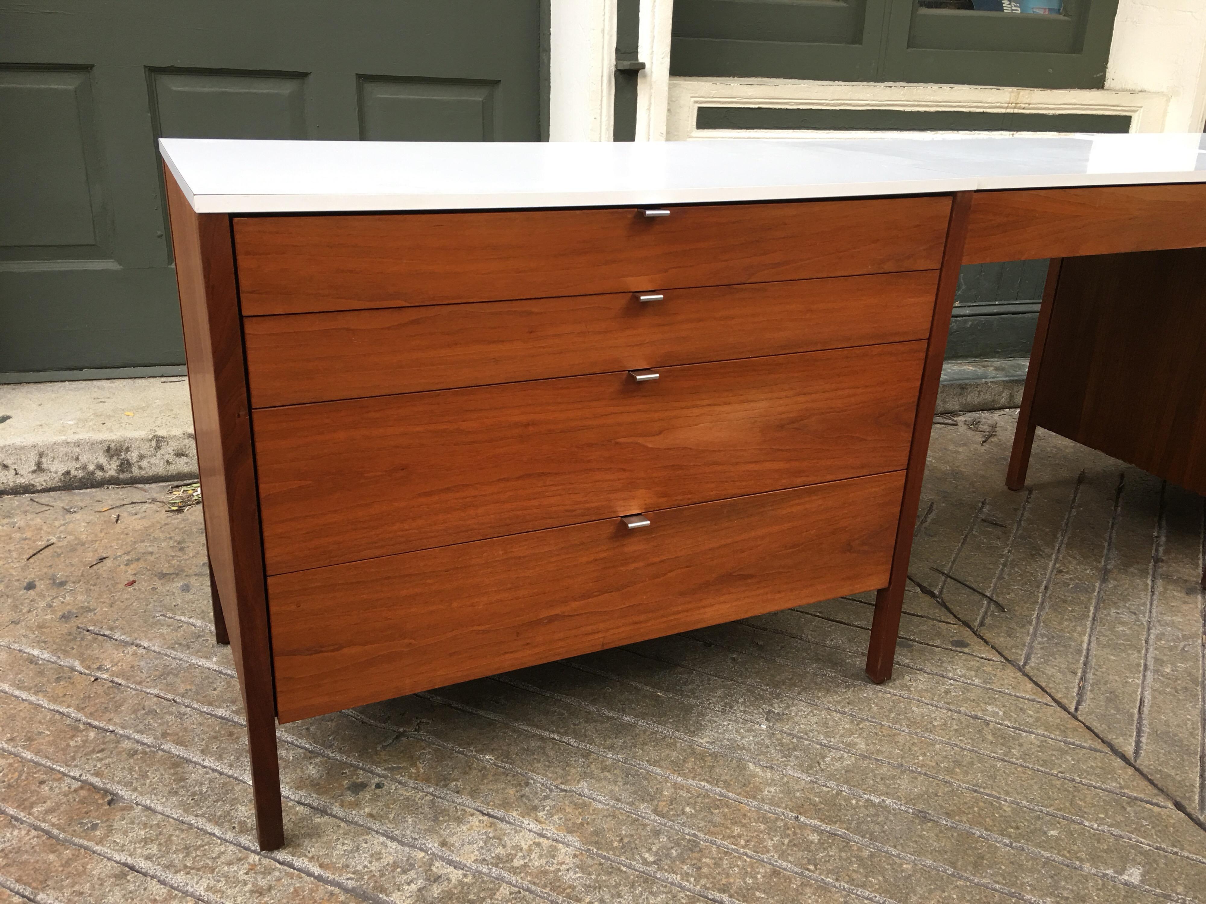 Florence Knoll for Knoll dresser and desk/vanity in walnut with white Formica tops and chrome drawer pulls. One three drawer and the other four with one drawer in suspended vanity/desk. All original and bought from the original owner.