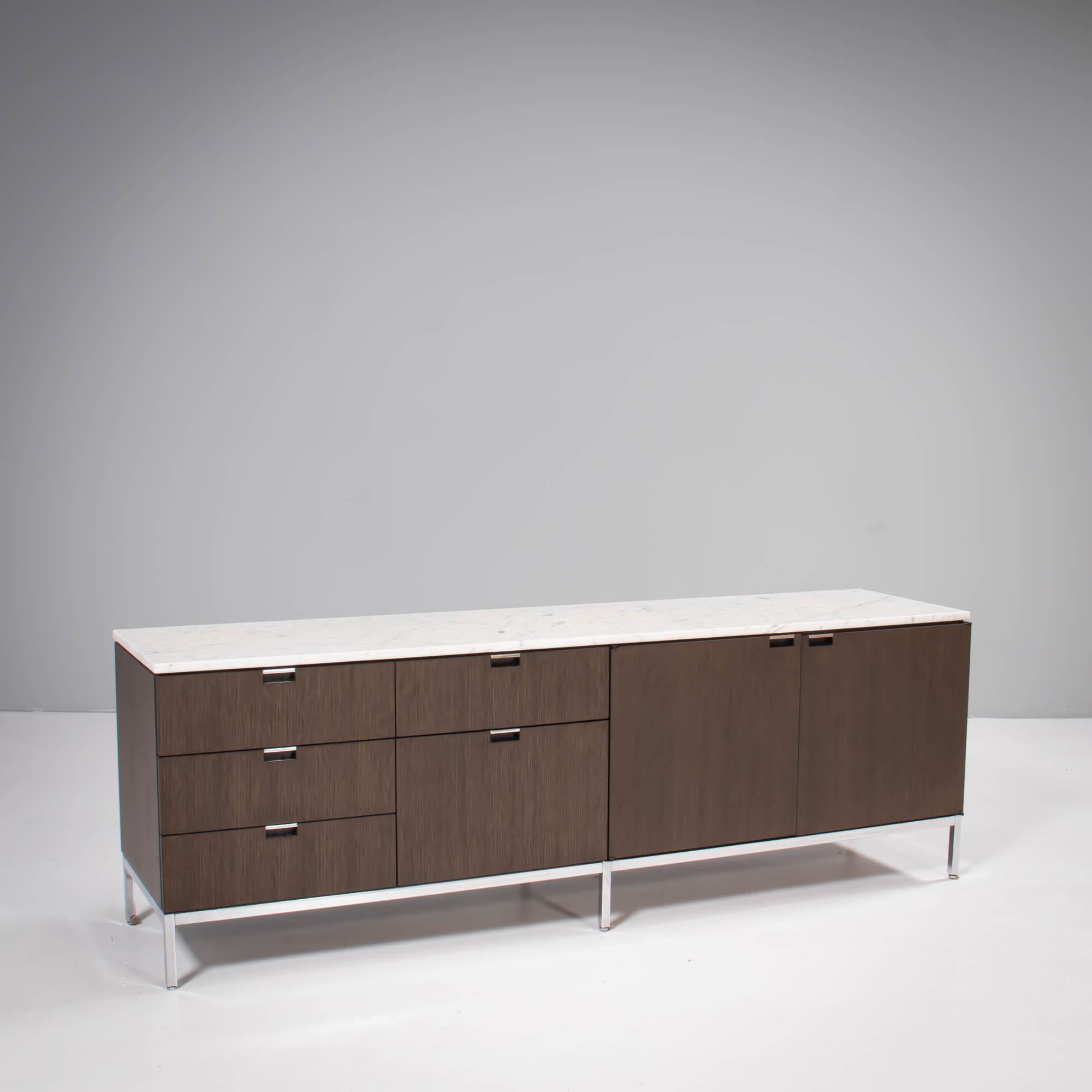 Originally designed in 1961, the Florence Knoll credenza has since become one of Knoll’s iconic furniture pieces.

Constructed from ebonised oak, the credenza sits on a square tubular steel base with a polished chrome finish.

With two cupboard