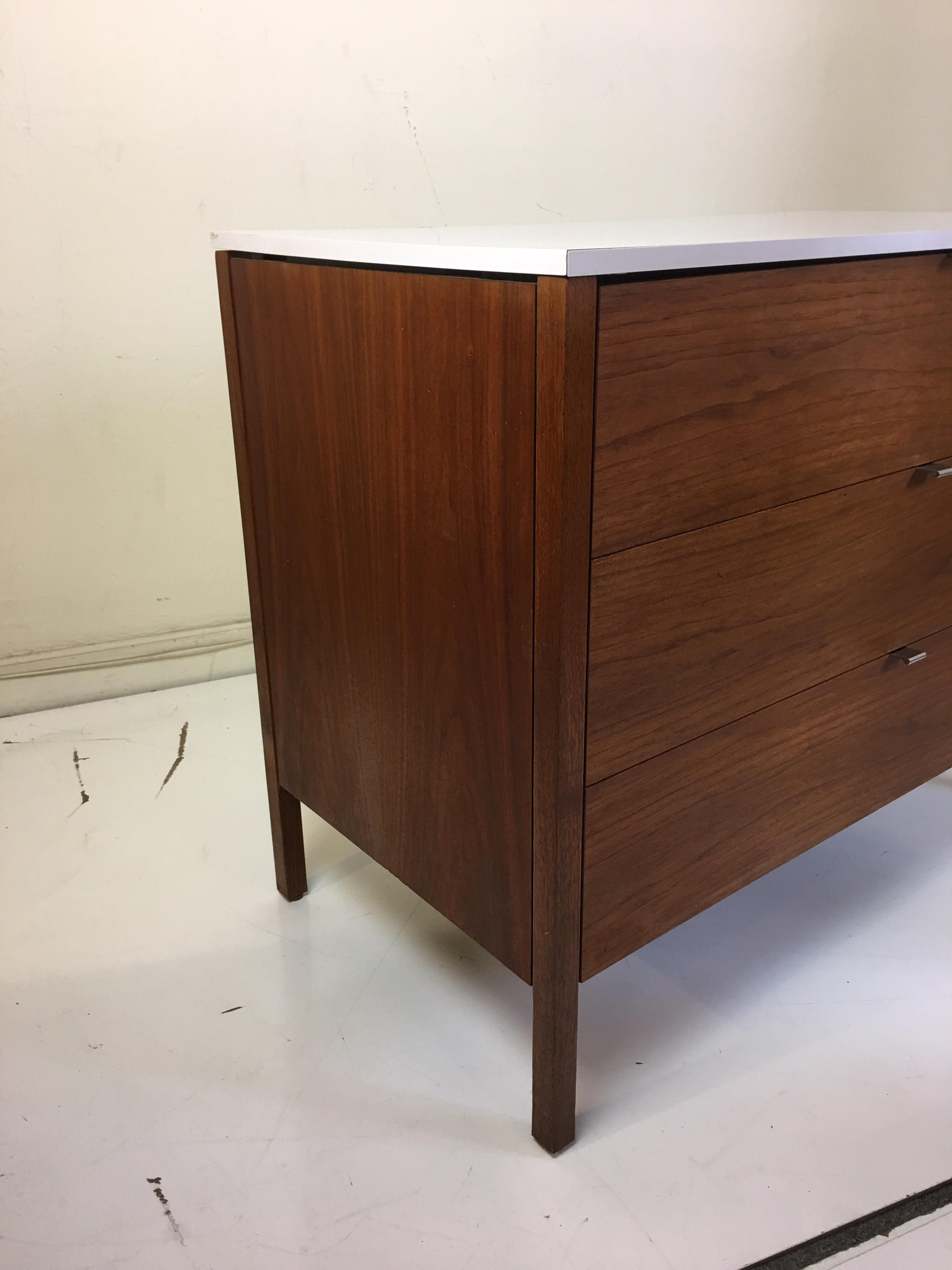 Florence Knoll for Knoll International dresser in walnut with chrome drawer pulls and white laminate top.