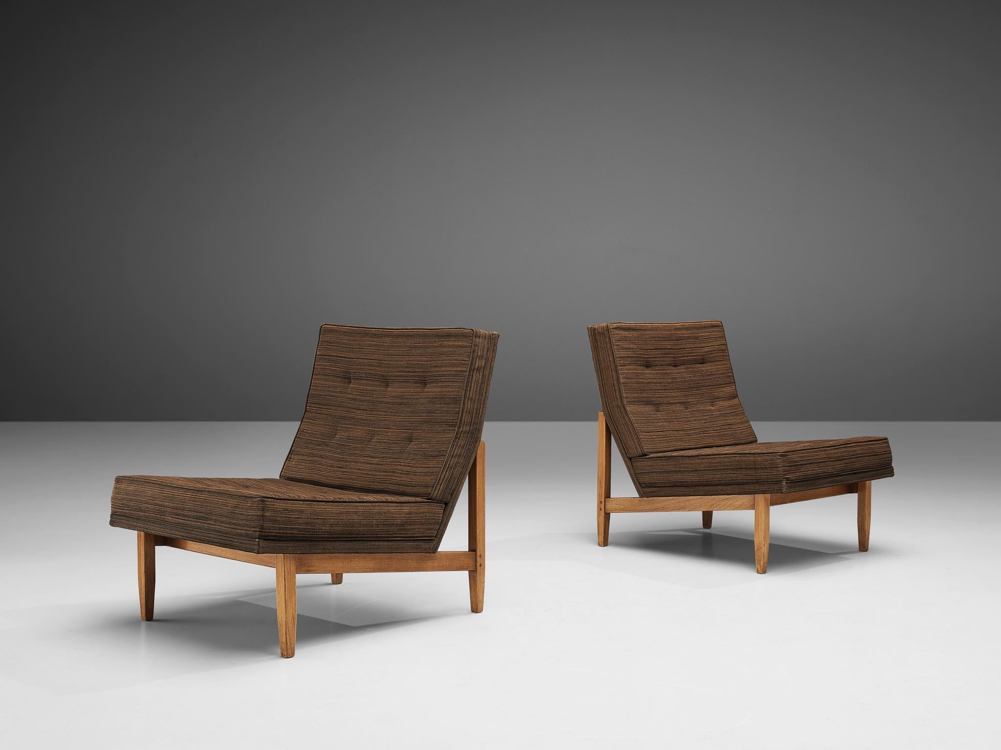 Florence Knoll for Knoll International, lounge chairs model '51', teak, fabric, United States, 1955

Stunning pair of Florence Knoll's parallel bar lounge chairs model '51'. The frame, made of teak, is armless, but has a sleek form. The angled seat