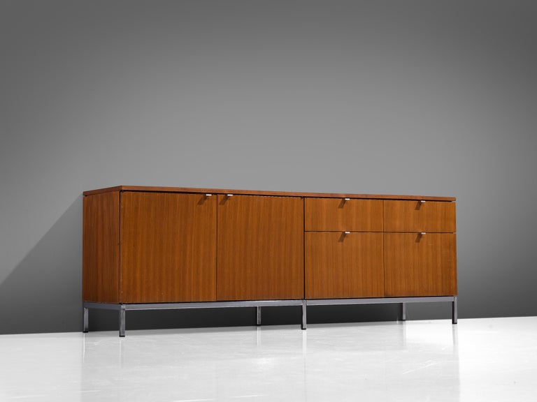 Florence Knoll for Knoll International, sideboard, teak, steel, walnut, United States, 1961 

This minimalistic sideboard was made with the aim of creating office furniture that would meet the special needs in establishing a pleasant and healthy