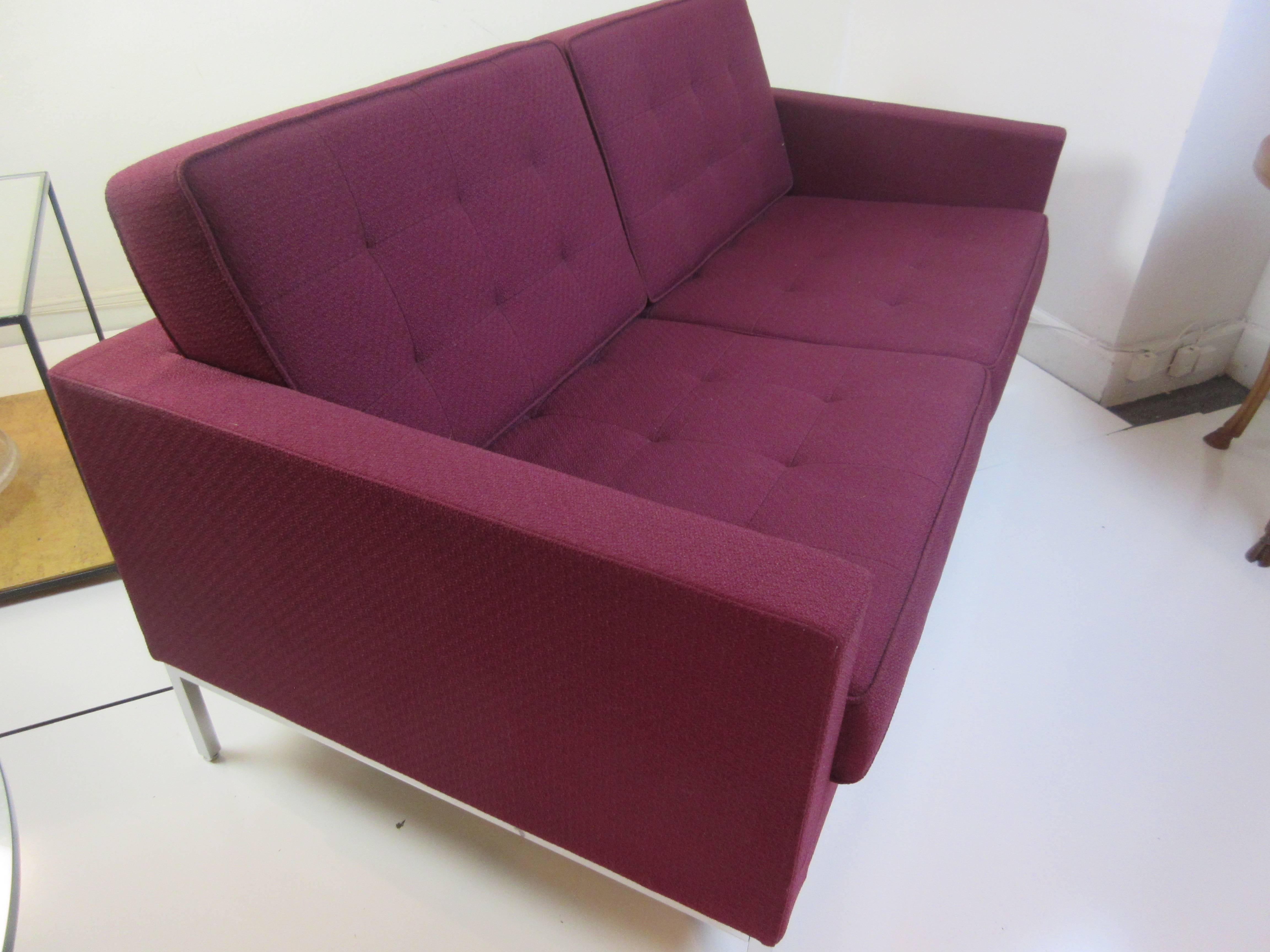 Florence Knoll settee in Knoll Rochelle purple fabric. Part of her 1954 series of seating for Knoll this is a 2010 addition and in perfect condition.