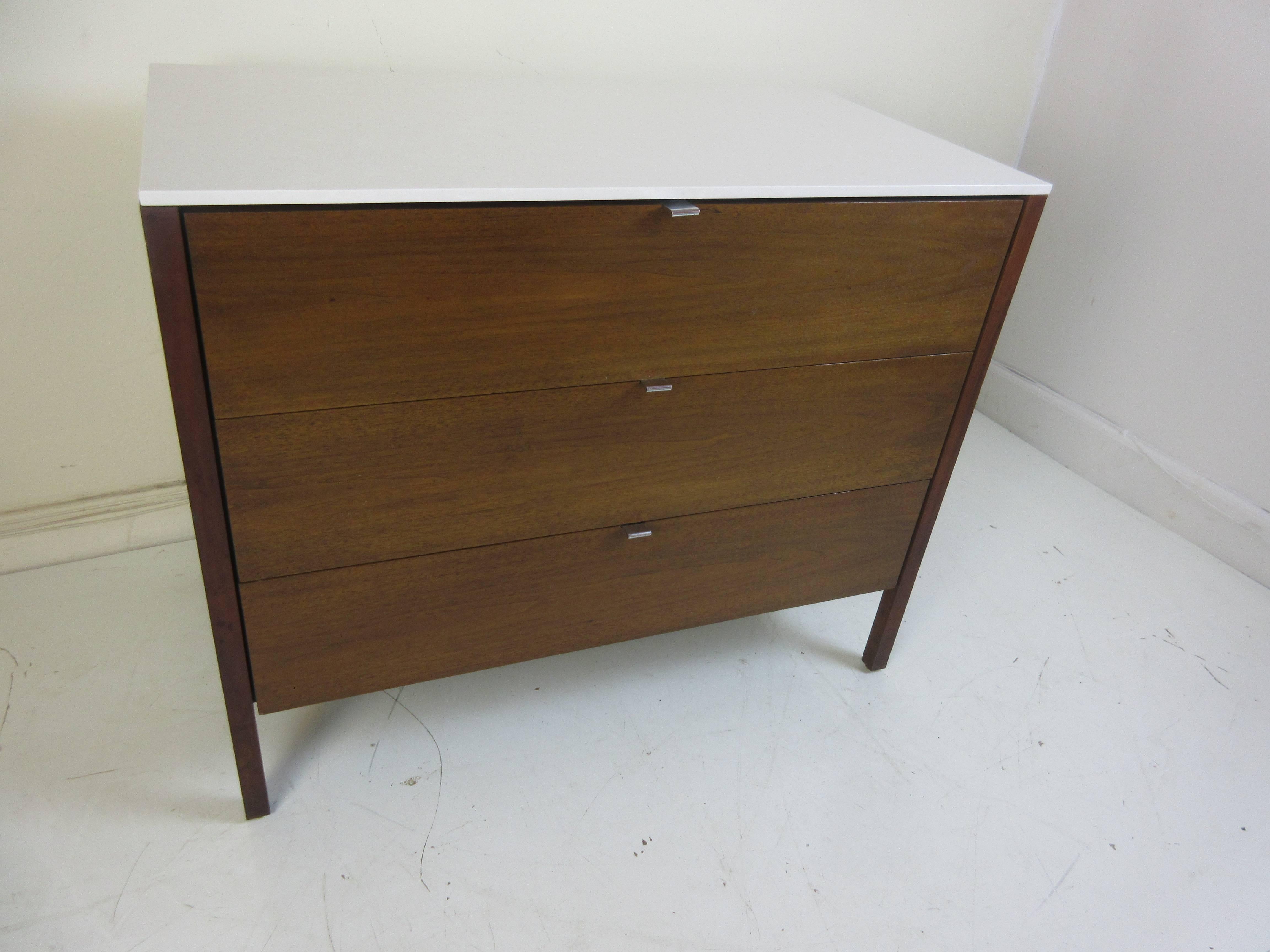 Florence Knoll for Knoll three-drawer cabinet with replacement silestone top (replaces a chipped white formica top) Also available is a four drawer cabinet in slightly lighter tone of walnut with same silestone top in white.