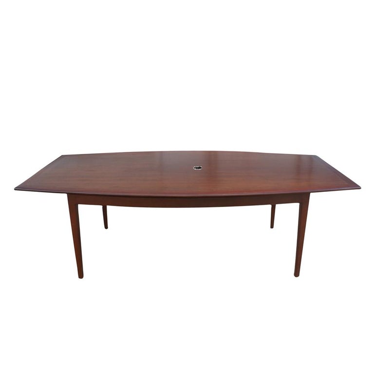 An 8ft mid century dining or conference table designed by Florence Knoll. Walnut base and top. 