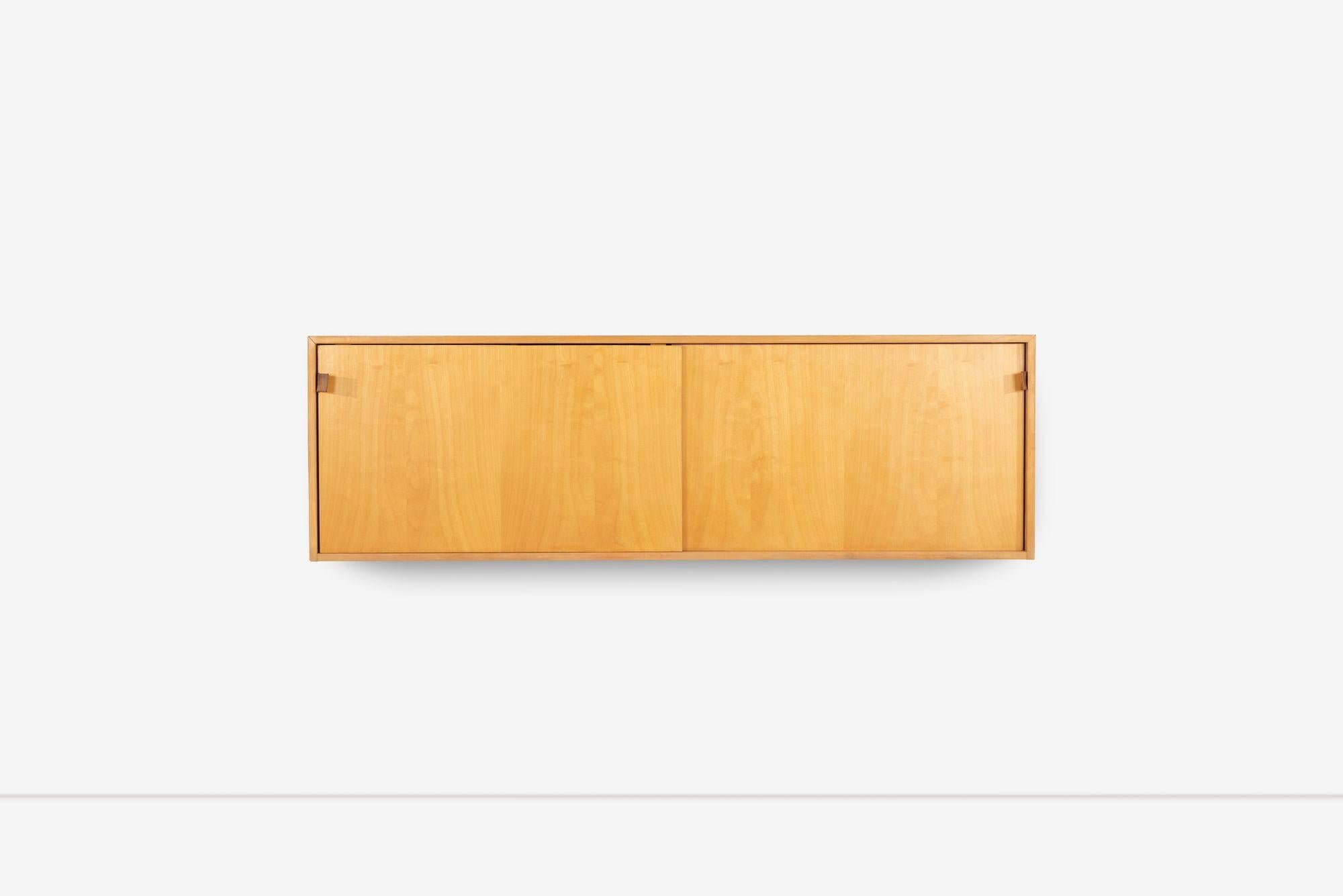 Florence Knoll Hanging Cabinet for Knoll International, Model 121
Birch case with drop front doors. Inside pull-out drawer with flatware dividers, Adjustable wood shelves, and Saddle leather pulls.