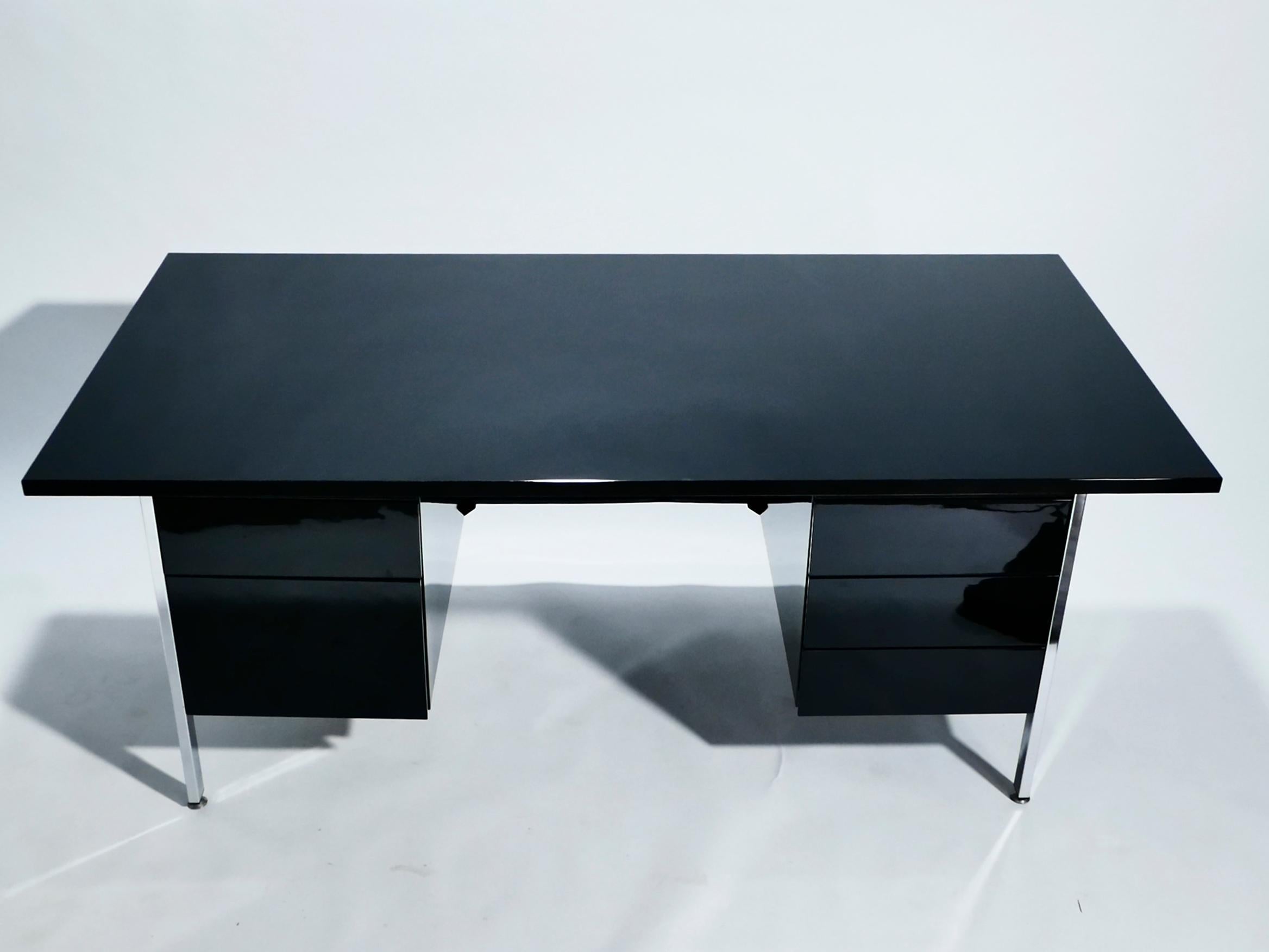 Perfect Mid-Century Modern proportions, designed by Florence Knoll for Knoll International in 1955, this desk model 1503 has a decidedly vintage mood. The black lacquer surfaces and chrome feet and accents look contemporary enough for the piece to